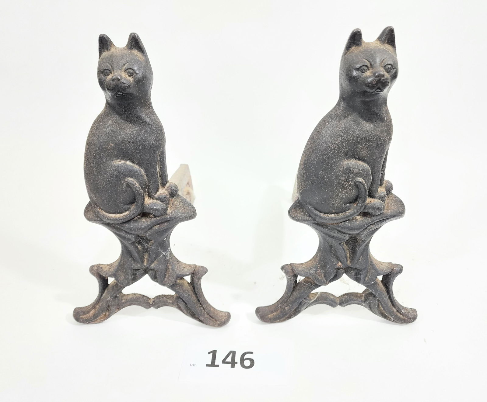 PAIR OF CAT ANDIRONS: American, late 19th century. M. Greenwood and Co. cast iron. Diminutive size, 12.5" high.