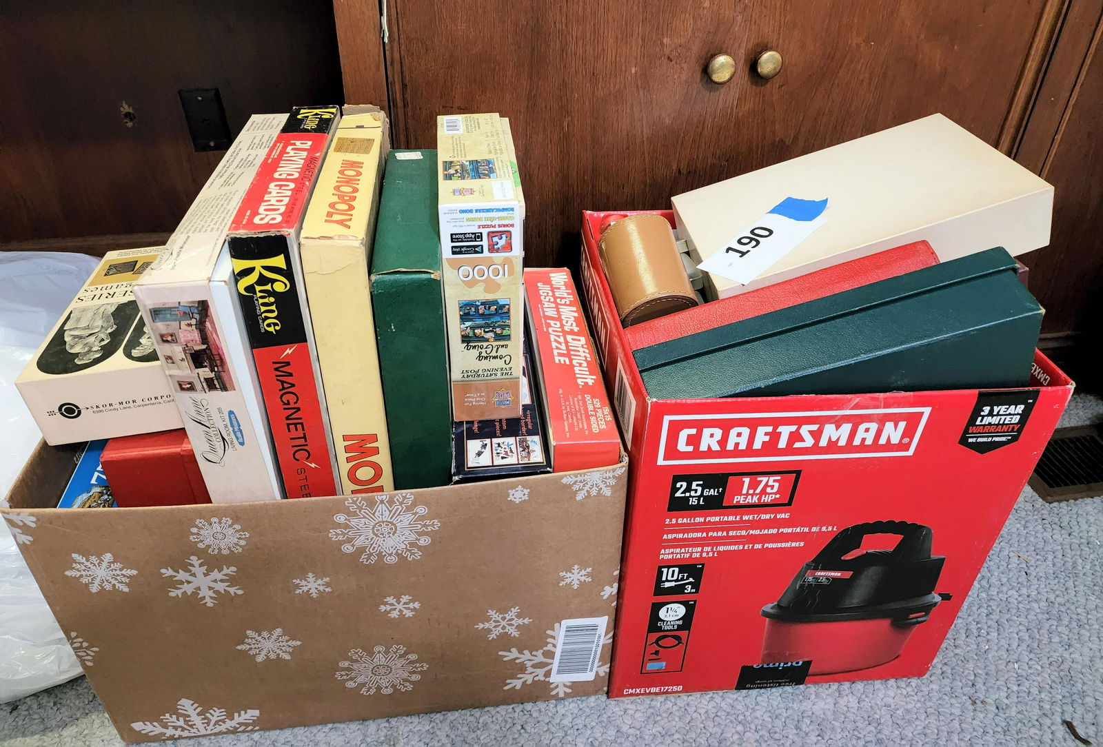 COLLECTION OF BOARD GAMES AND PUZZLES: Some are vintage, and includes several wooden jigsaw puzzles.