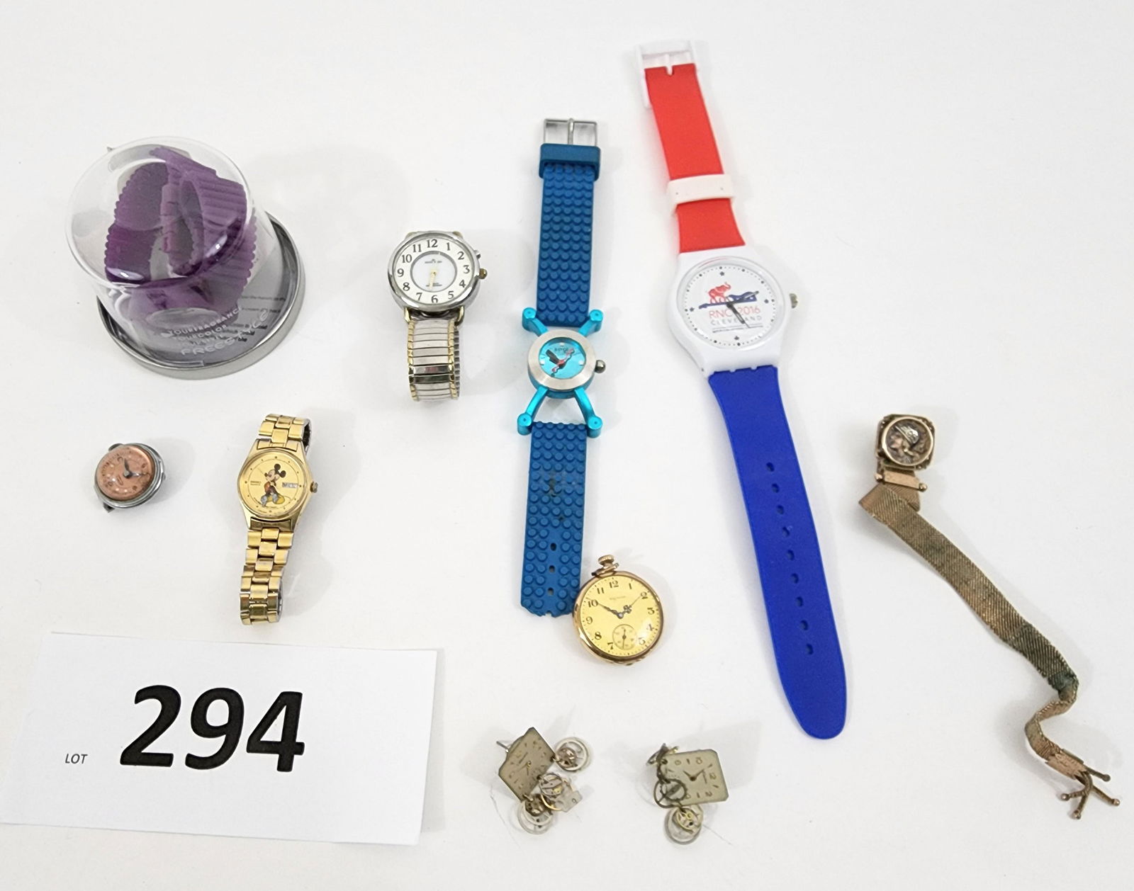 WATCHES AND CHAINS: American, late 19th century watch chain with fringe and coin, probably gold filled, no marks; American 20th century clip-watch by Cord , inscribed "Dorothy Wycoff, Cleve. O, Feb 1941"; American, 19th