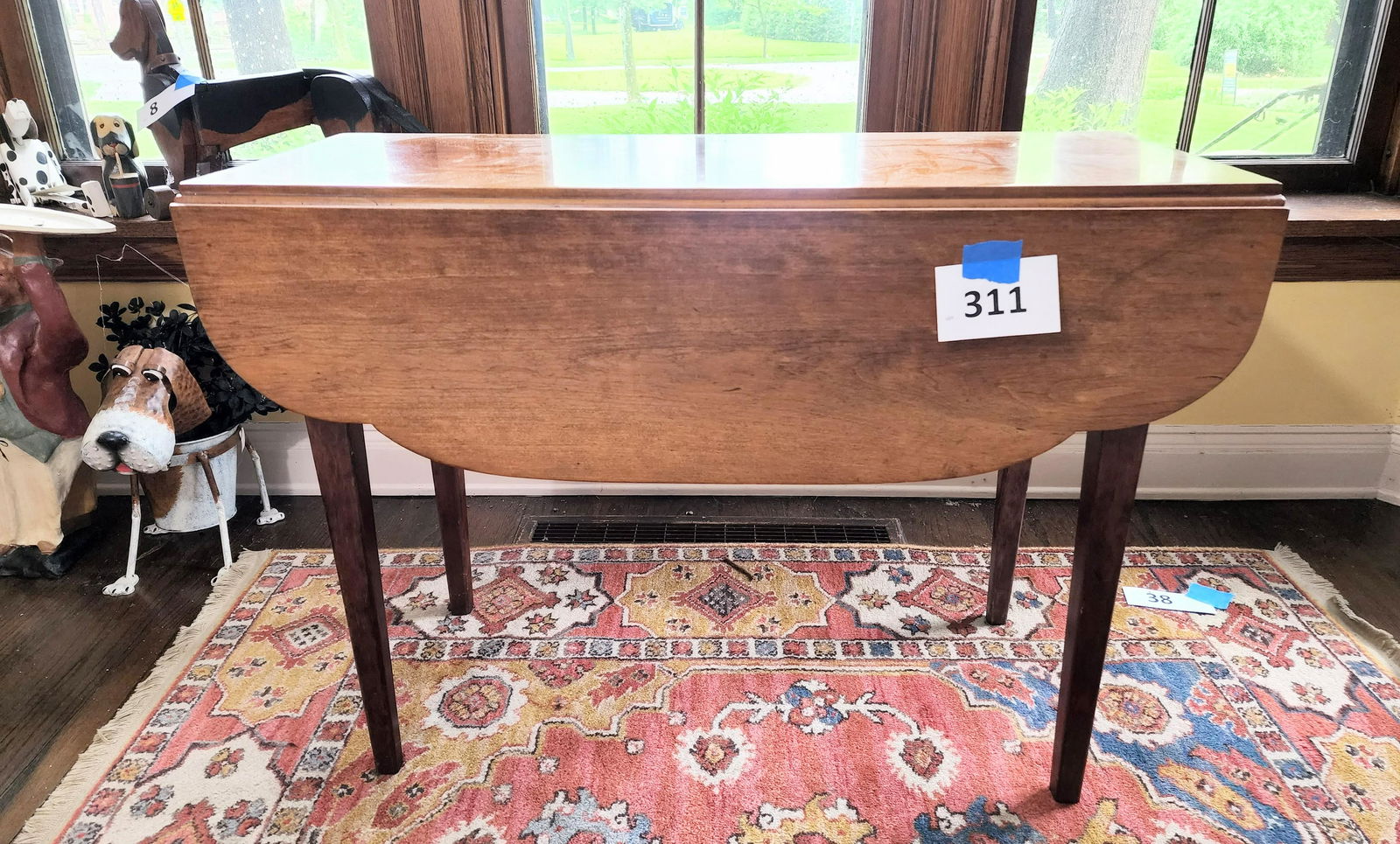 HEPPLEWHITE DROP-LEAF TABLE: American, early 19th century, cherry. Shaped leaves and tapered legs. 27" high, 36.25" wide, 15.5" deep (closed).