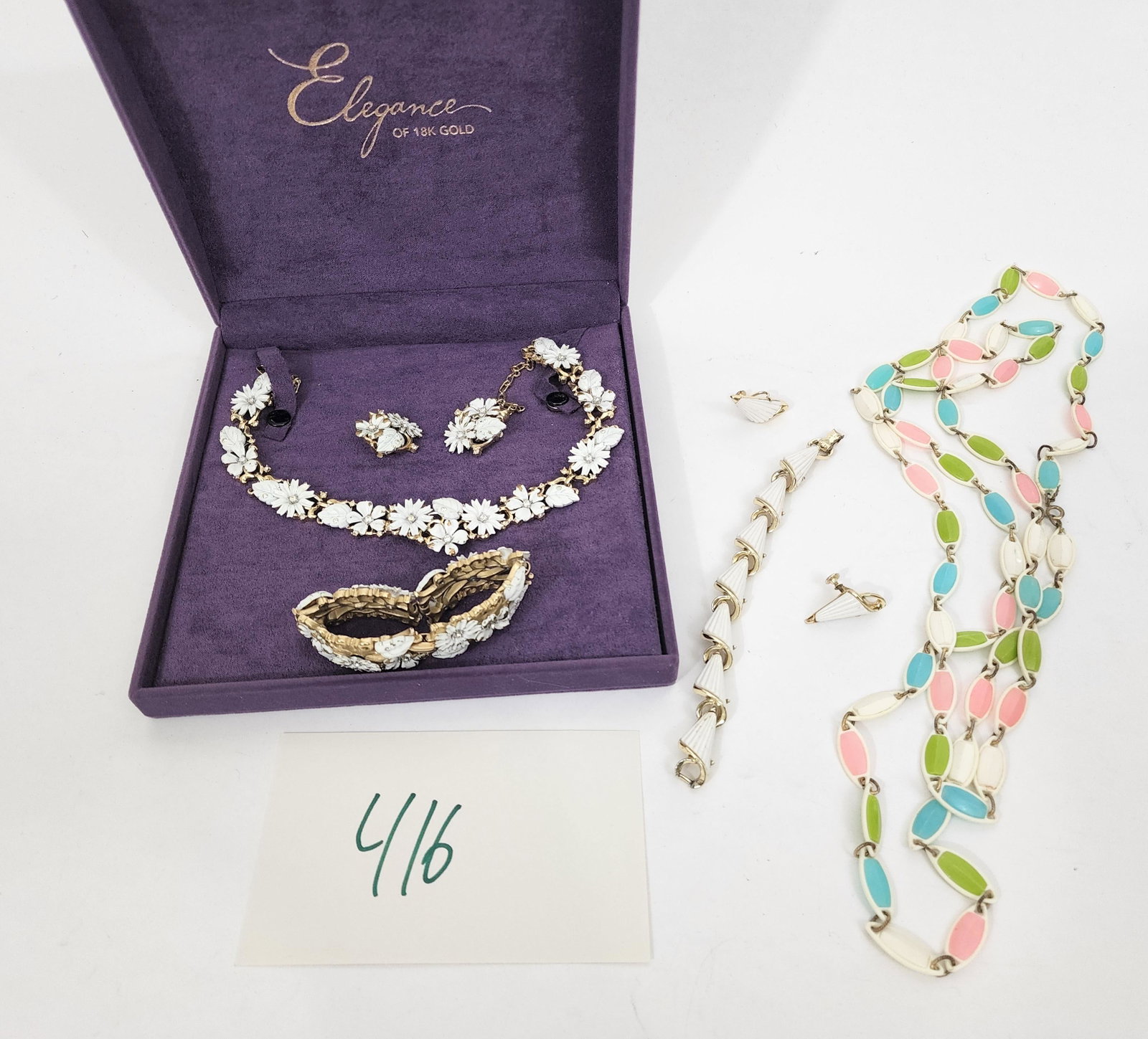 CROWN TRIFARI PARURE & VINTAGE COSTUME JEWELRY: American, 1957. Vintage Crown Trifari Fieldflowers parure of white enamel flowers that move with rhinestones, includes necklace, bracelet and clip earrings, signed. American, mid 20th century demi-par