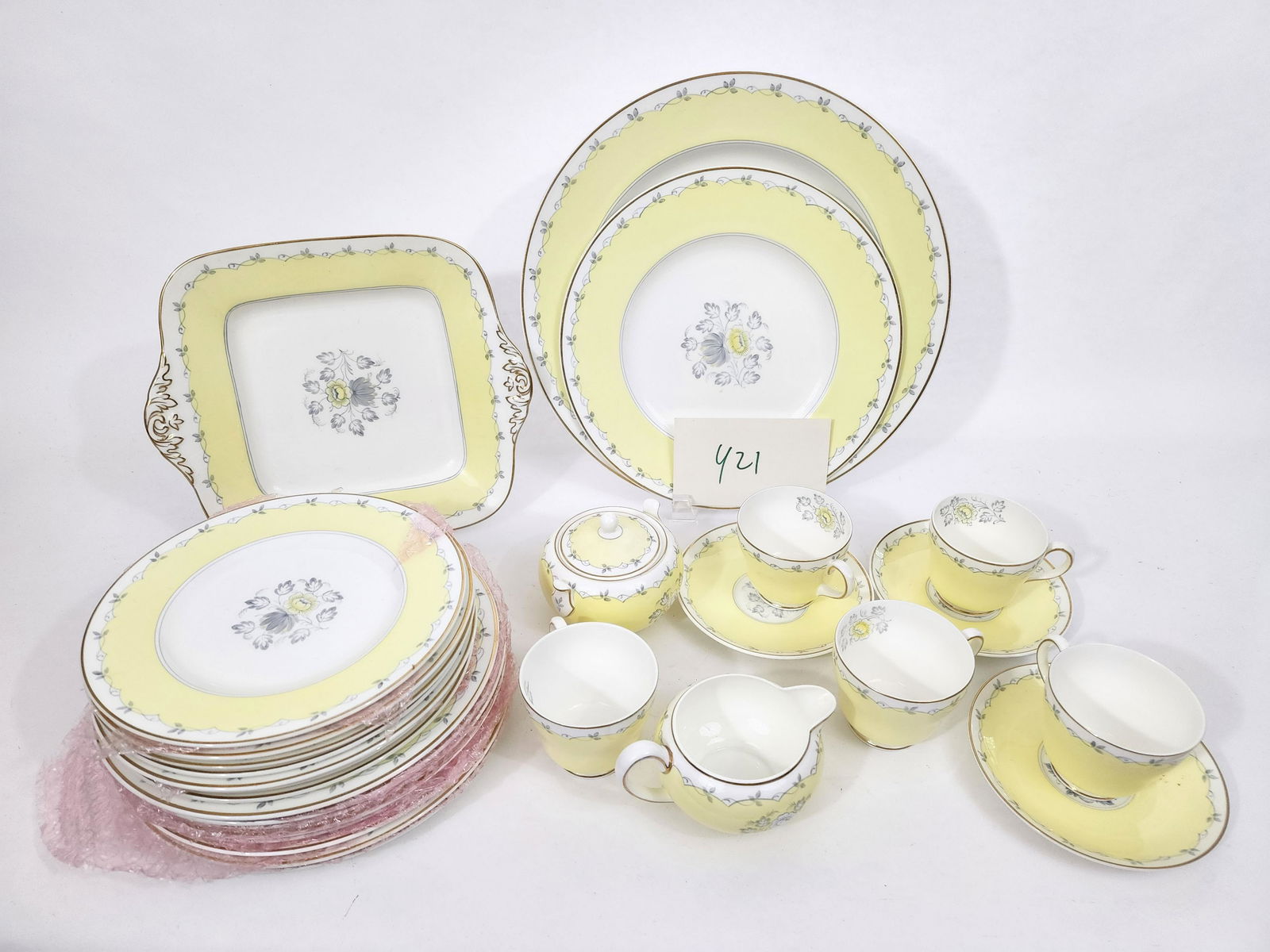 WEDGWOOD "PIMPERNEL" TEA SET: English, mid 20th century. Wedgwood partial porcelain teaset in the "Pimpernel" pattern, including creamer and sugar, luncheon plates (7), side plates (6), cups (9) and saucers (9).