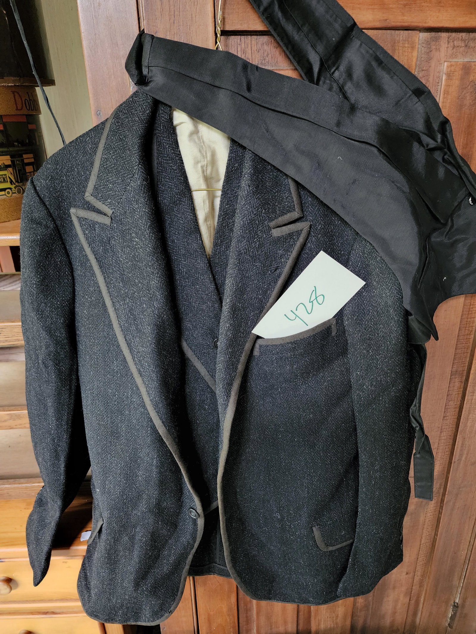 C. 1920 WOOL SUIT AND LONGJOHNS: American, early 20th century. Boy's wool shorts (swimming?), a pair of longjohns, a herringbone wool suit jacket and matching vest bearing a label for "Imported fabric exclusively by The F. and R. LAZ