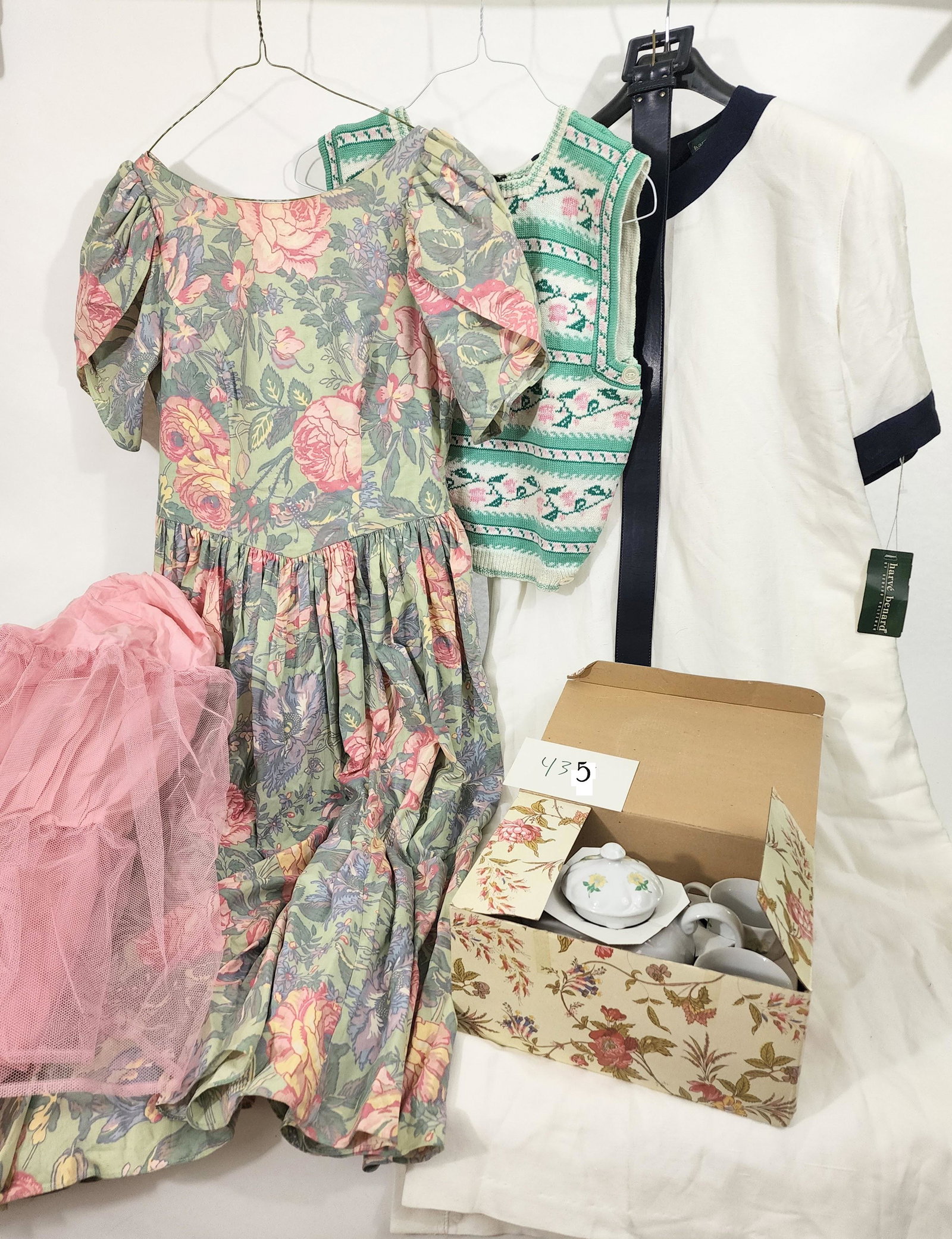 C. 1990 LAURA ASHLEY: England, 1989. Laura Ashley floral dress in a pink and green pattern with pink crinoline, size 14, tea length. And a preppy 1980s pink and green sweater vest by Cullinane , and never worn with tags Ha
