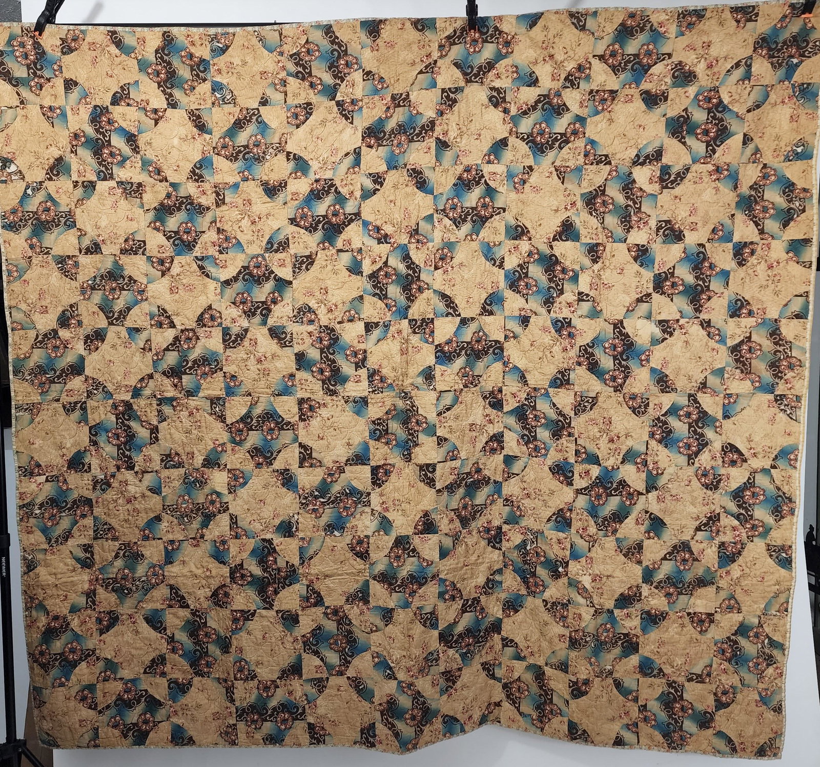 EARLY AMERICAN QUILT: 2nd quarter-19th century. Maltese Cross pieced quilt with ombrÃ© blues with pillar prints. Quilted clamshell all over. Approx. 75" x 72".