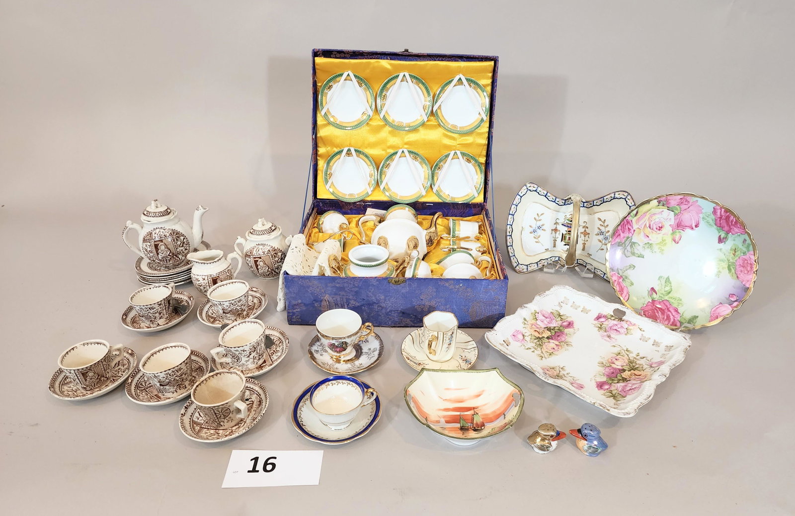 COLLECTION OF CHINA INCLUDING CHILD'S TEA SET: Includes English brown transfer child's tea set, boxed French-style porcelain tea set, and other miscellaneous pieces that include Austria, Bavarian, and Nippon.