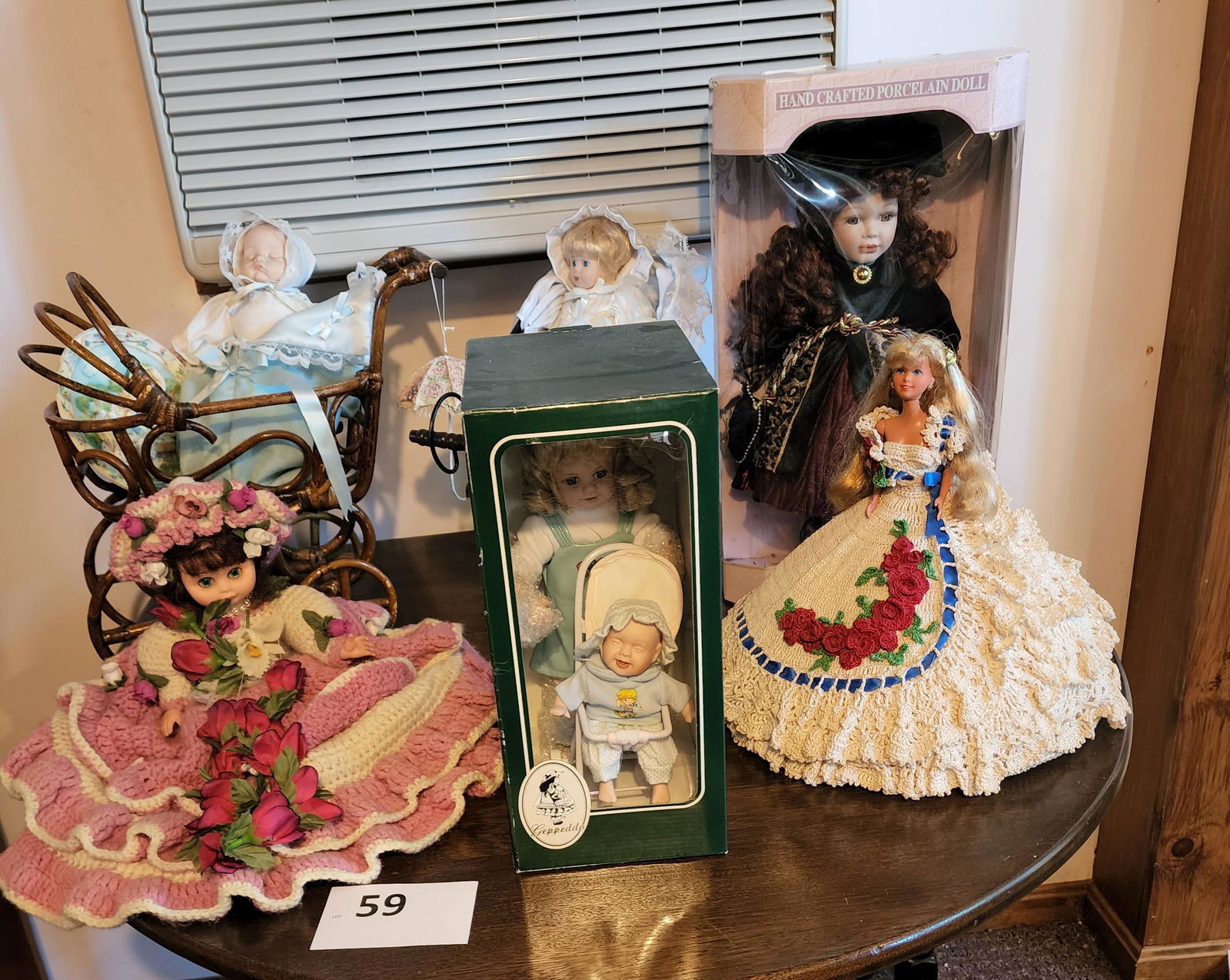 GROUP OF DOLLS, FIGURES, AND DOLL FURNITURE: Includes Mickey Mouse, Snow White, several dolls new in box, two windsor doll chairs, a doll-sized rocking chair, a doll push chair, and more. Four boxes.