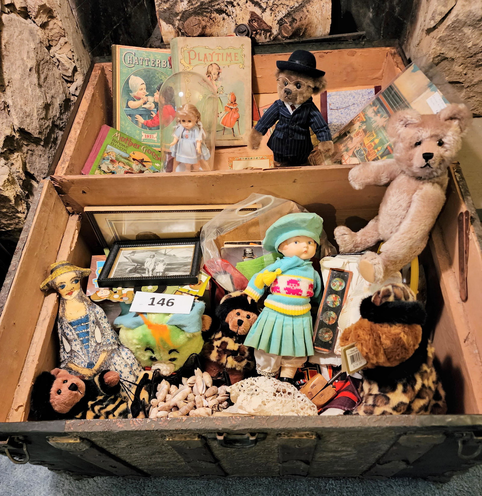 VICTORIAN TRUNK FILLED WITH TOYS AND BOOKS: Includes a jointed bear, other dolls and animals, Victorian books, a box of magic lantern slides, and more.