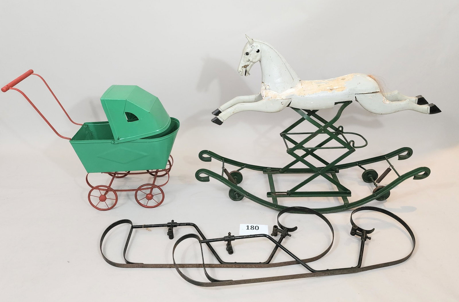 ROCKING HORSE, DOLL CARRIAGE, AND CARRIAGE SLEIGH RUNNERS: 19th-20th century. Rocking horse is 37" long; sleigh runners have a 16" axle length.