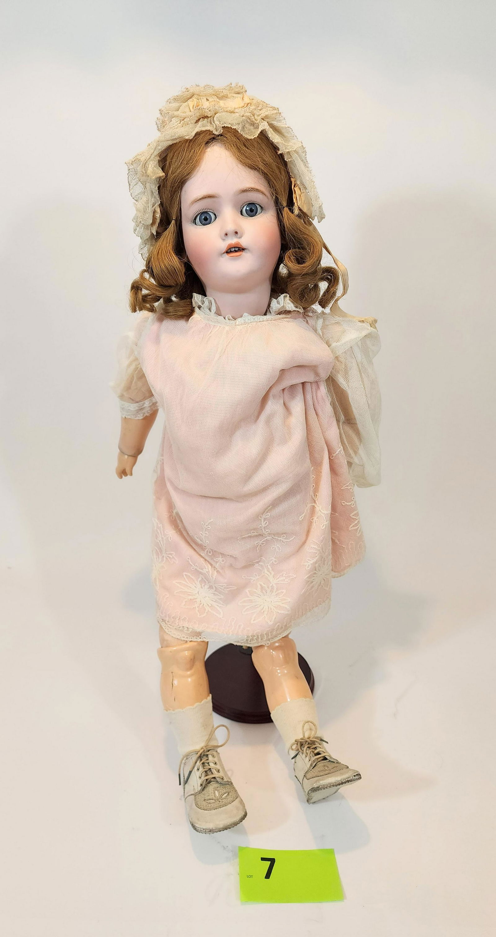 30" SIMON & HALBIG SLEEPY-EYE DOLL: Bisque head and composition body, open mouth with teeth, strawberry blonde hair, vintage pink lace dress and bonnet. 30" high.