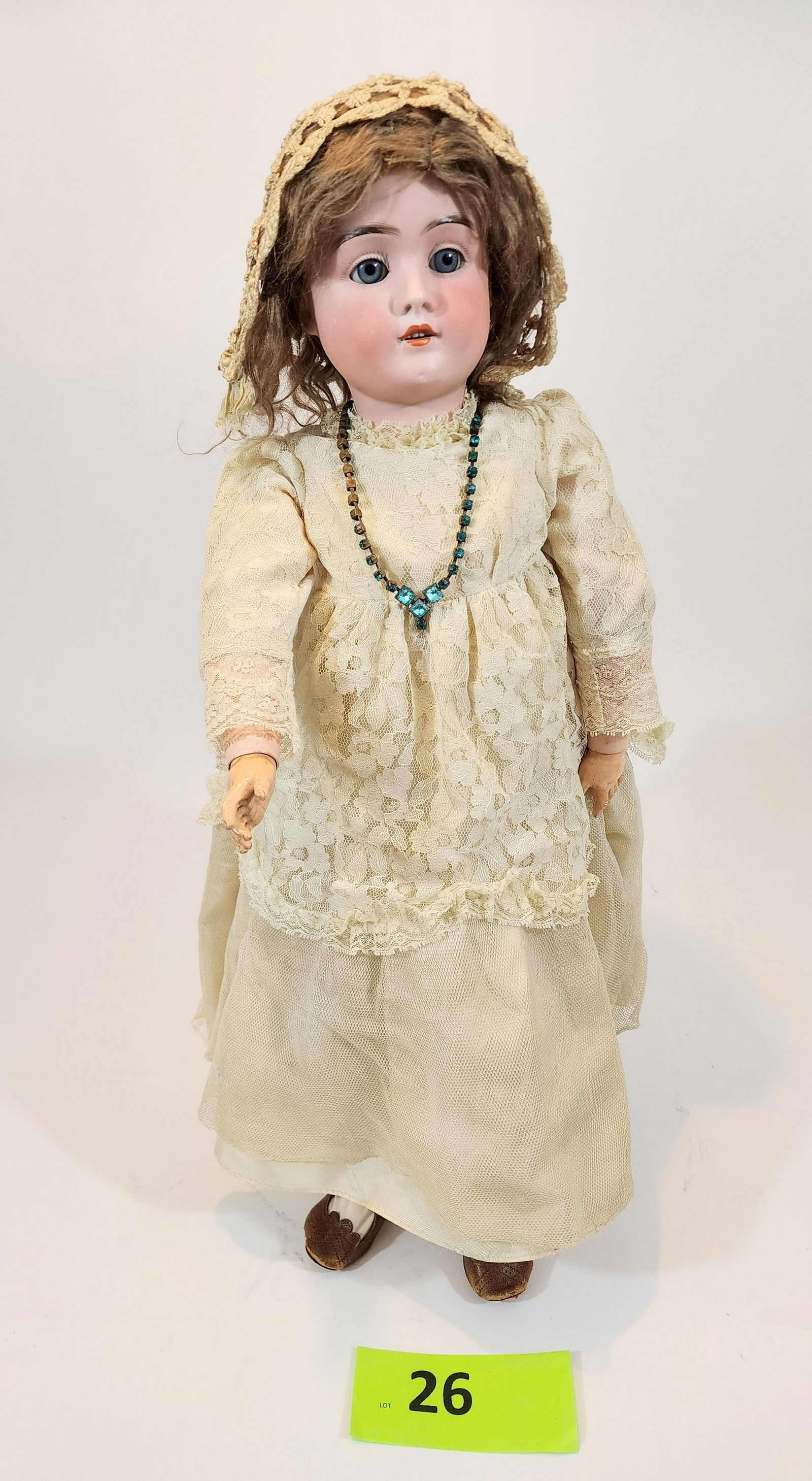 26" CATTERFELDER PUPPENFABRIK BY KESTNER: Sleepy-eye bisque head with composition body, open mouth with teeth, vintage dress. 26" high.