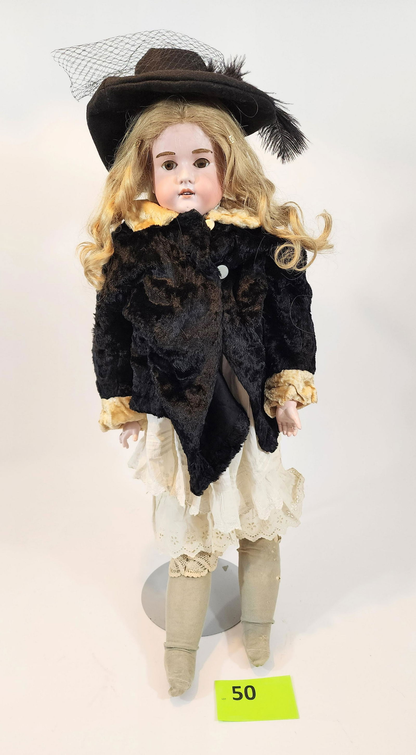 33" ARMAND MARSEILLE SLEEPY EYE DOLL: Bisque head and hands, stuffed body, long blonde curls, fur eyebrows, open mouth with teeth, vintage dress and coat. 33" high.