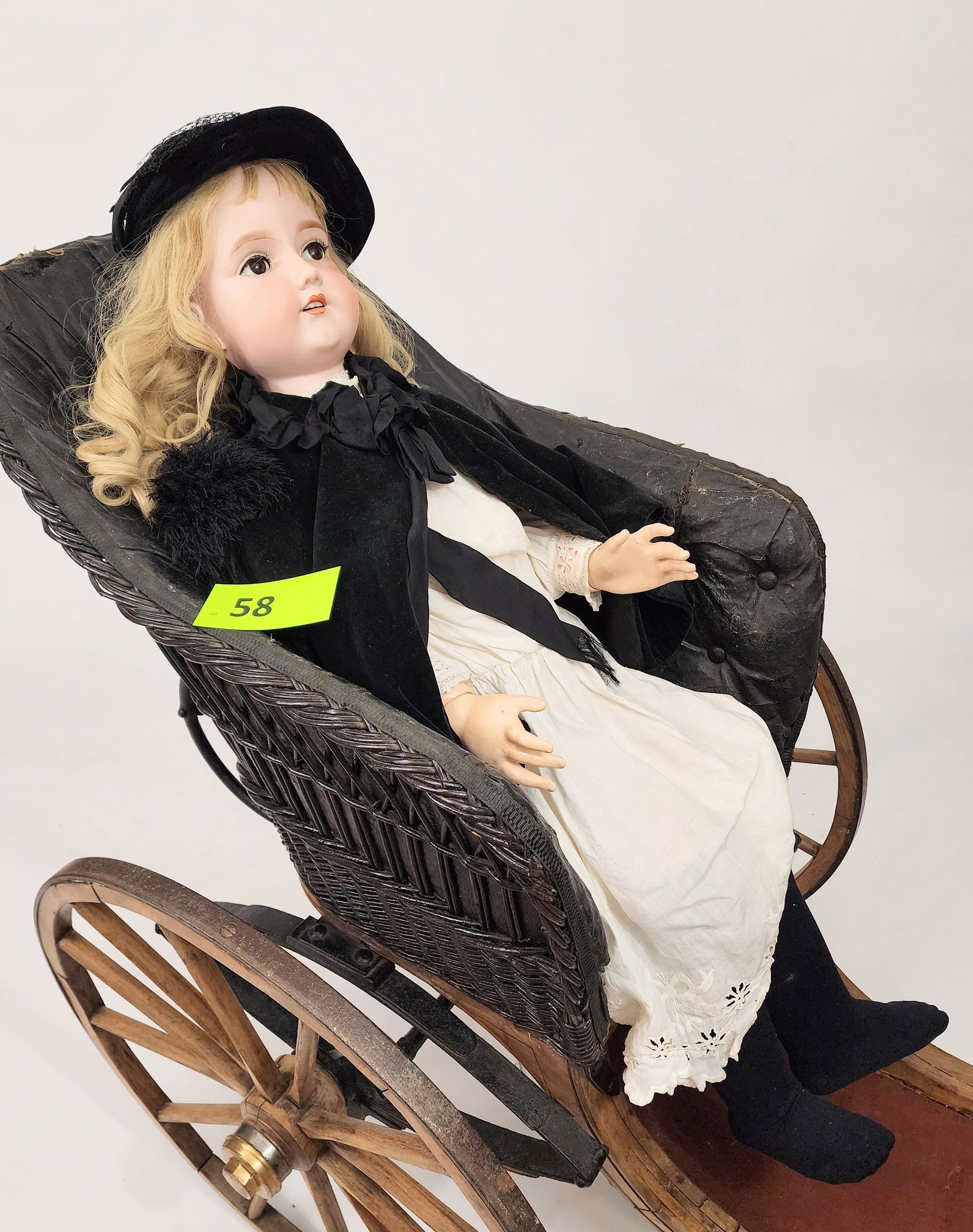 42" ARMAND MARSEILLE SLEEPY-EYE DOLL: Bisque head and composition body, sleepy eyes, open mouth with teeth, blonde hair, in black velvet outfit and matching hat, white gown with lace and embroidered trim. 42" high.
