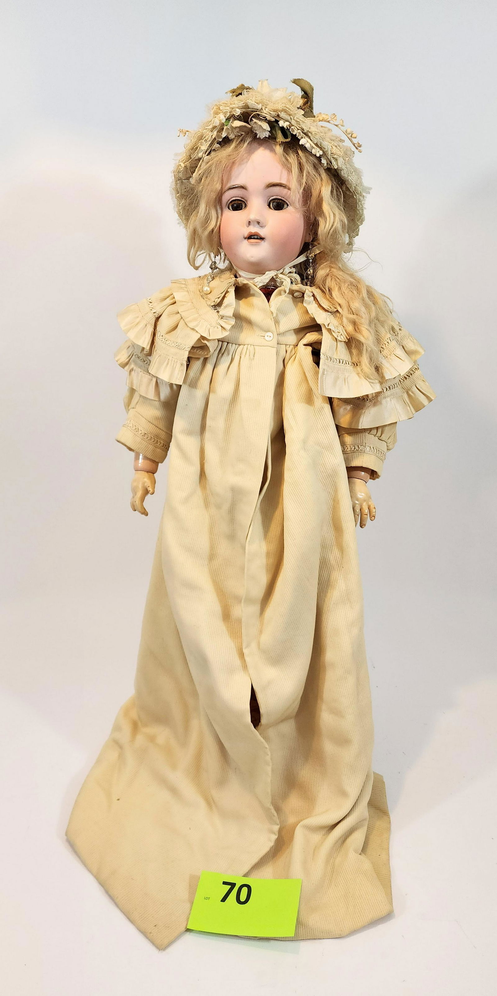 32" WALKURE SLEEPY-EYE DOLL: Bisque head and composition body, open mouth with teeth, blonde, earrings, vintage velvet dress with beautiful long ribbed overcoat and bonnet, 32" high.