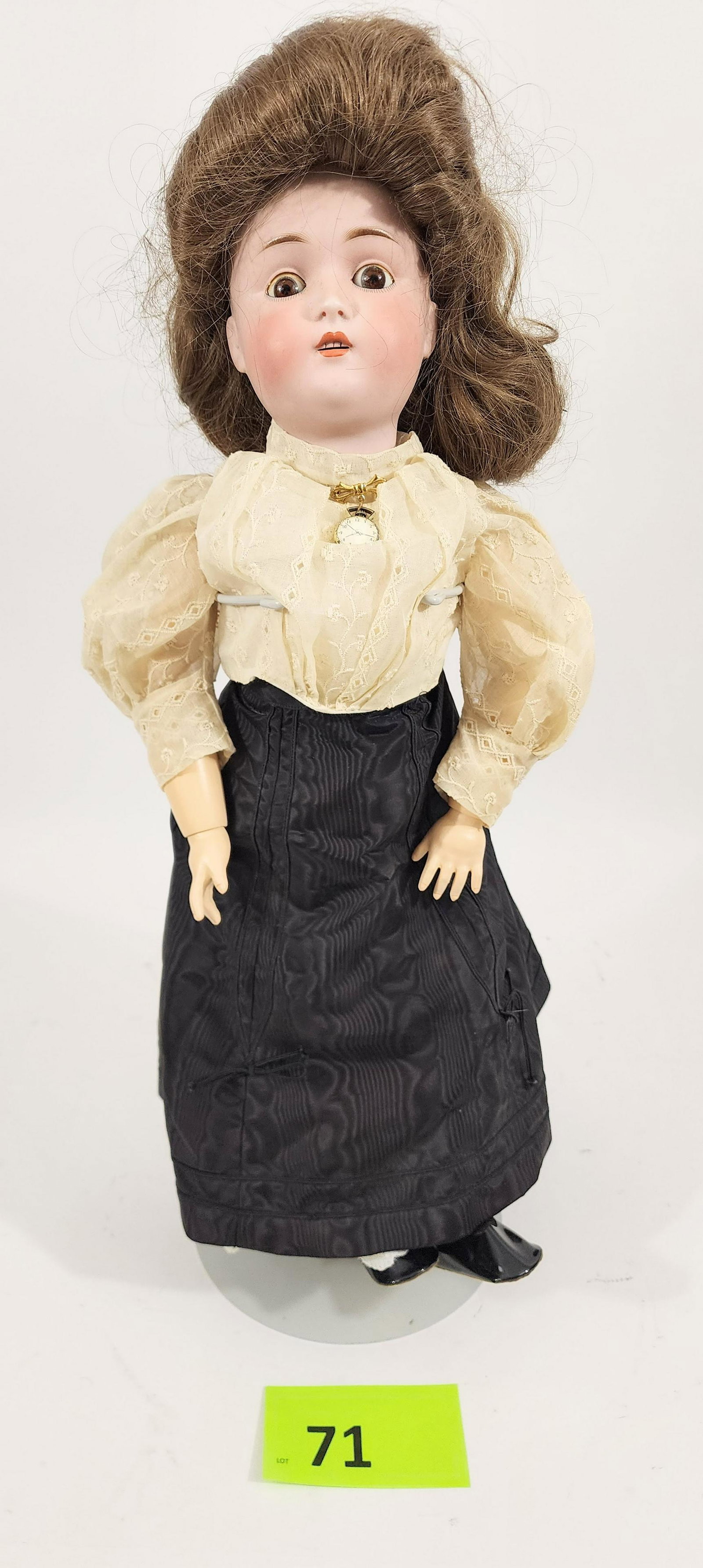 23" GERMAN BISQUE-HEAD DOLL: Marked as made in Germany, composition body, sleepy eyes, open mouth with teeth, in vintage top and modern skirt and brooch. 23" high.