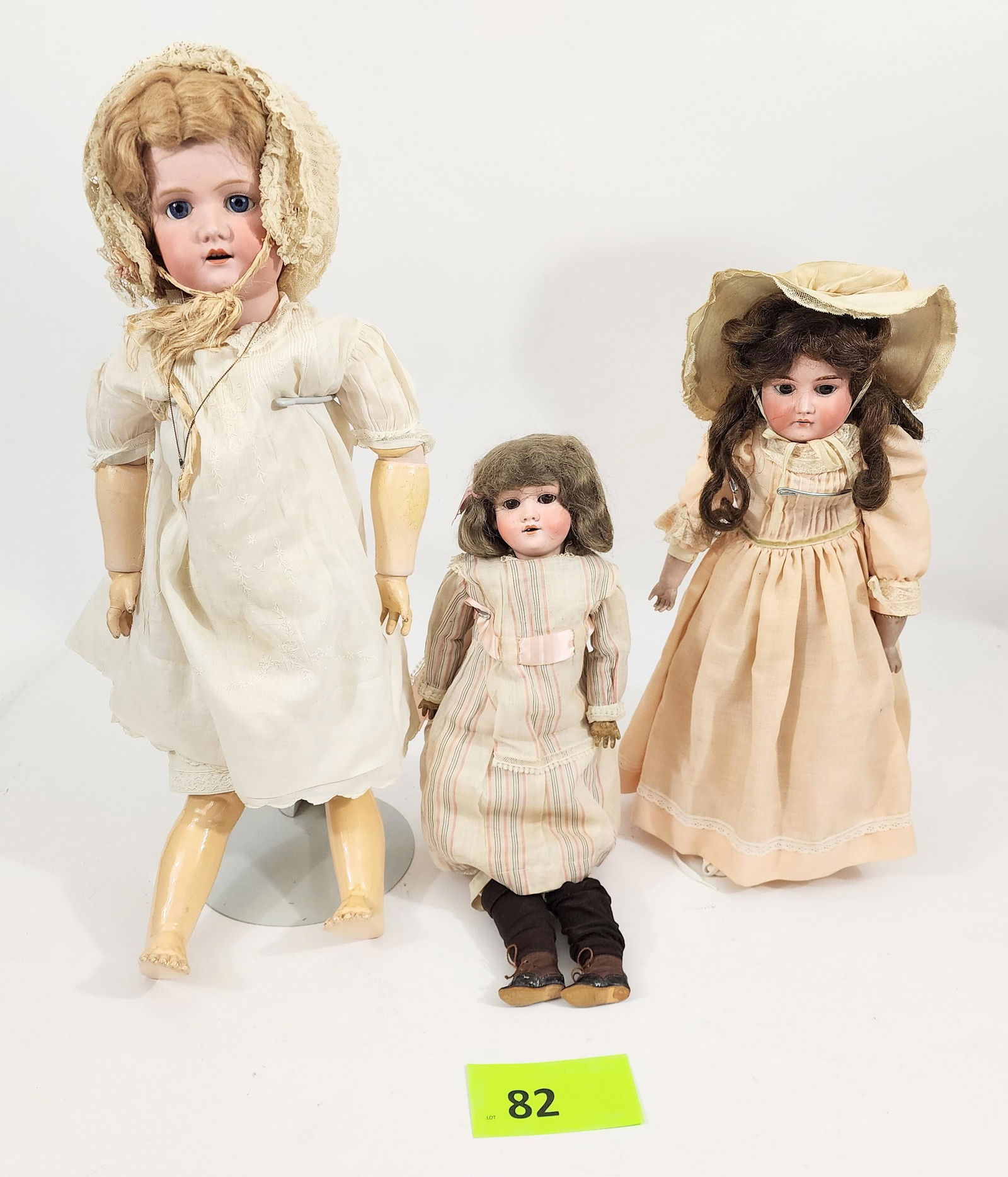 THREE BISQUE-HEAD DOLLS: Largest marked for Morimura, sleepy eyes and open mouth with teeth, bisque and composition; smallest is Walkure/Kley & Hahn with sleepy eyes and open mouth with teeth, also bisque and composition; mid
