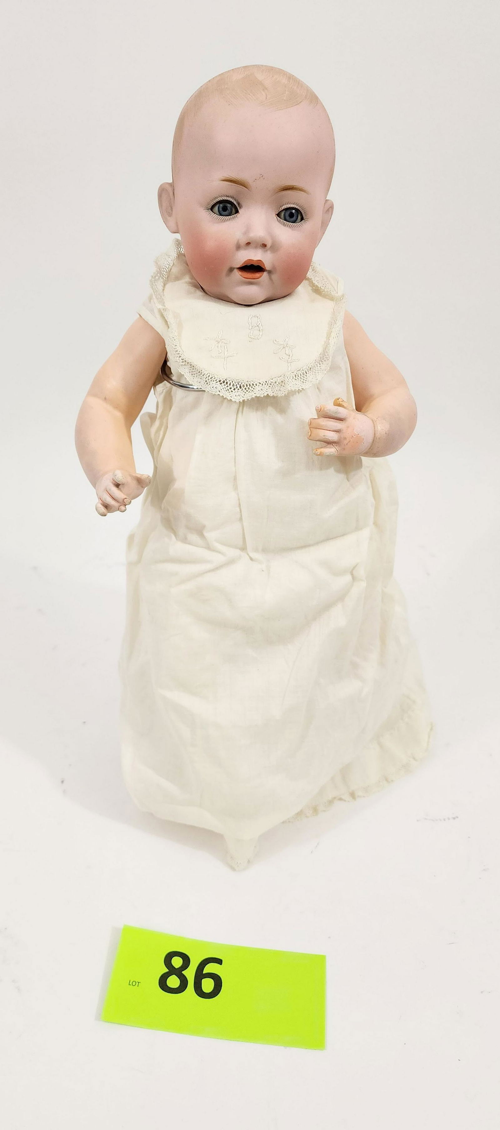 16" KESTNER "HILDA" DOLL: Bisque head, arms and feet on jointed china body, composition body, sleepy eyes, open mouth with teeth, painted hair, vintage cotton gown with lace trim. 16" high.