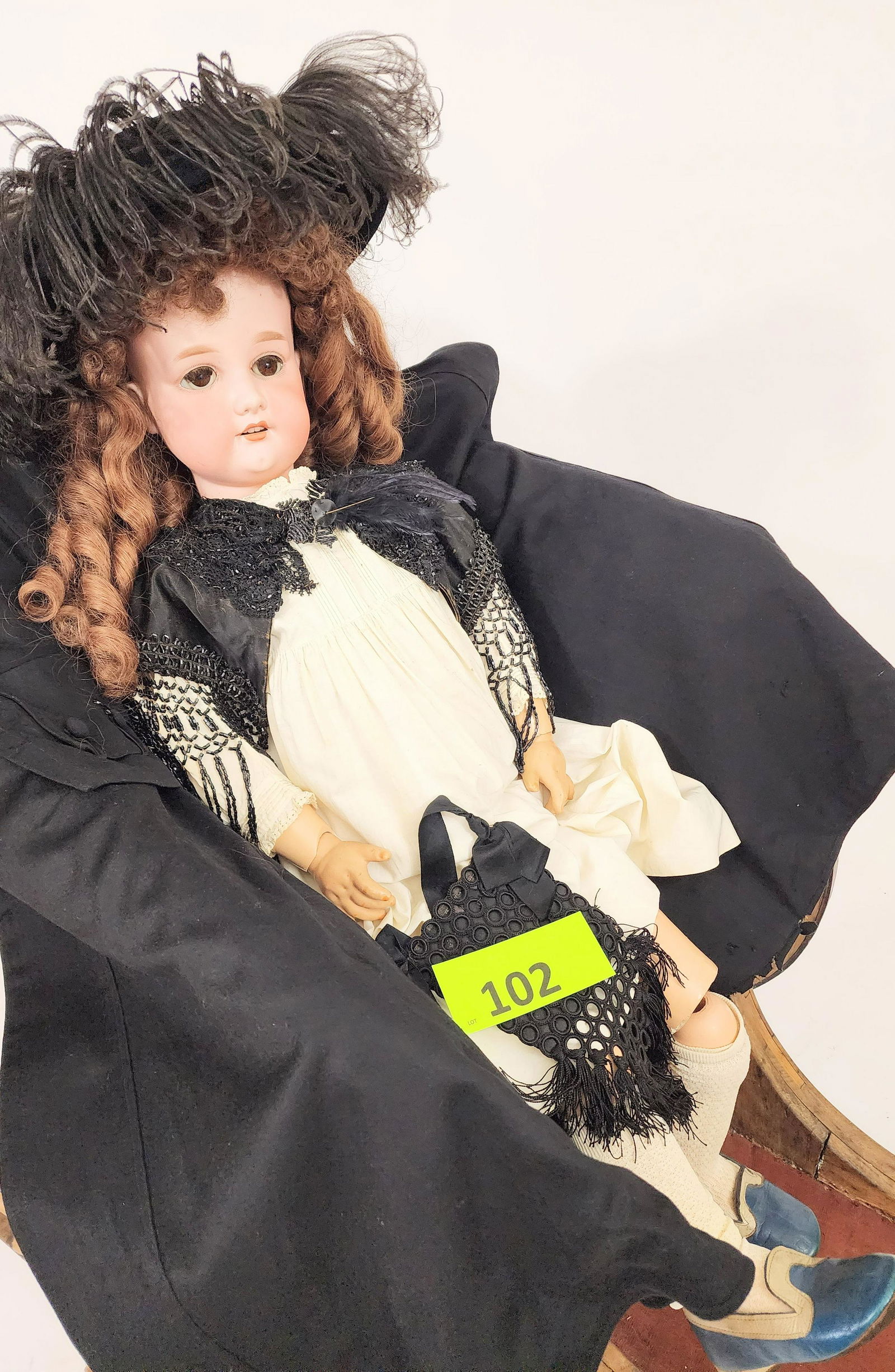 36" ARMAND MARSEILLE DOLL: Bisque head and composition body, sleepy eyes, open mouth with teeth, chestnut ringlet curls, in white gown and with beaded wrap, black open-work handbag, and black velvet hat with ostrich feathers. 3