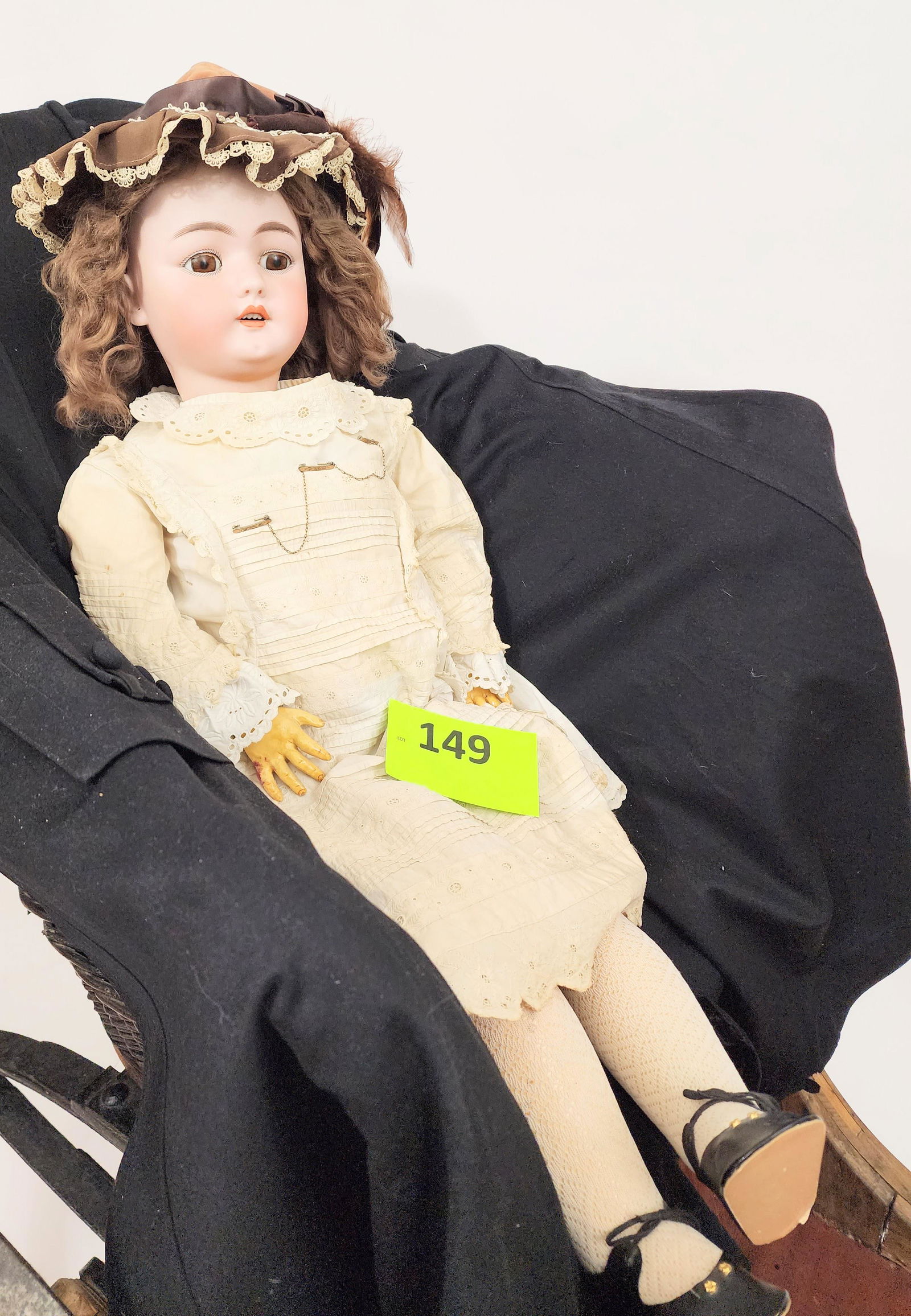 32" SIMON-HALBIG SLEEPY-EYE DOLL: Bisque head and composition body, sleepy eyes, open mouth with teeth, pierced ears, in white lace gown. 32" high.