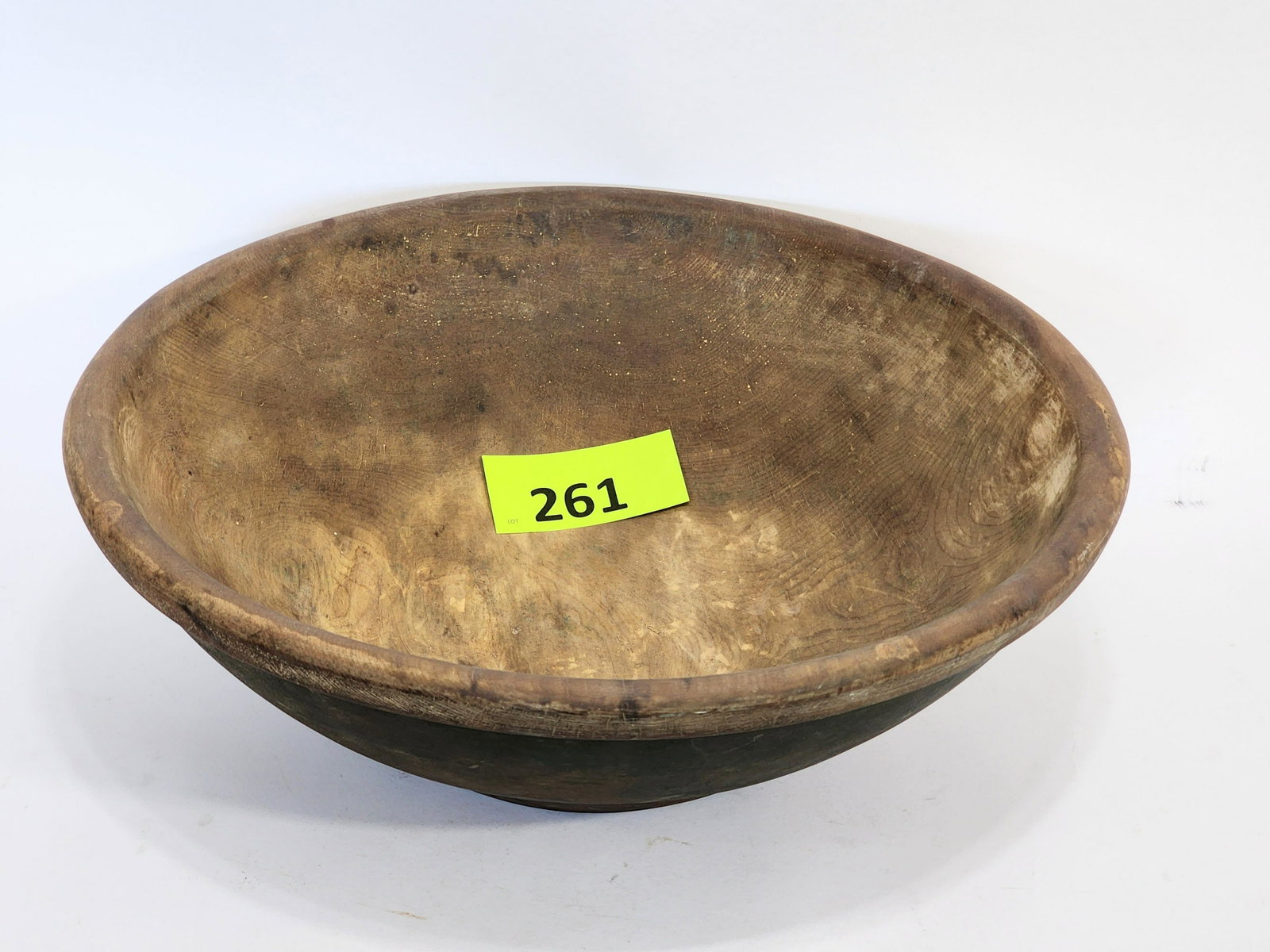 PAINTED TREEN BOWL: America, 19th century, poplar. Large bowl with rim, slight foot, and retains traces of old/original green paint. 20.5" diameter.