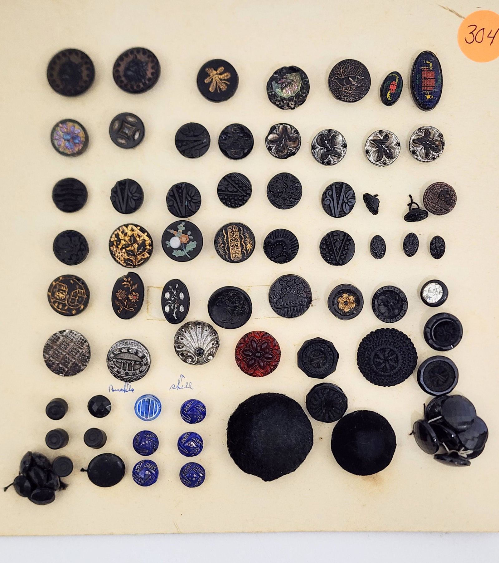 GROUP OF VICTORIAN BUTTONS: Mid-late 19th century. Group consists of approximately 75 buttons including Jet, Gutta Percha, painted, gilt accented, steel cut, fur covered and crochet covered. .25"-1.25” diameter