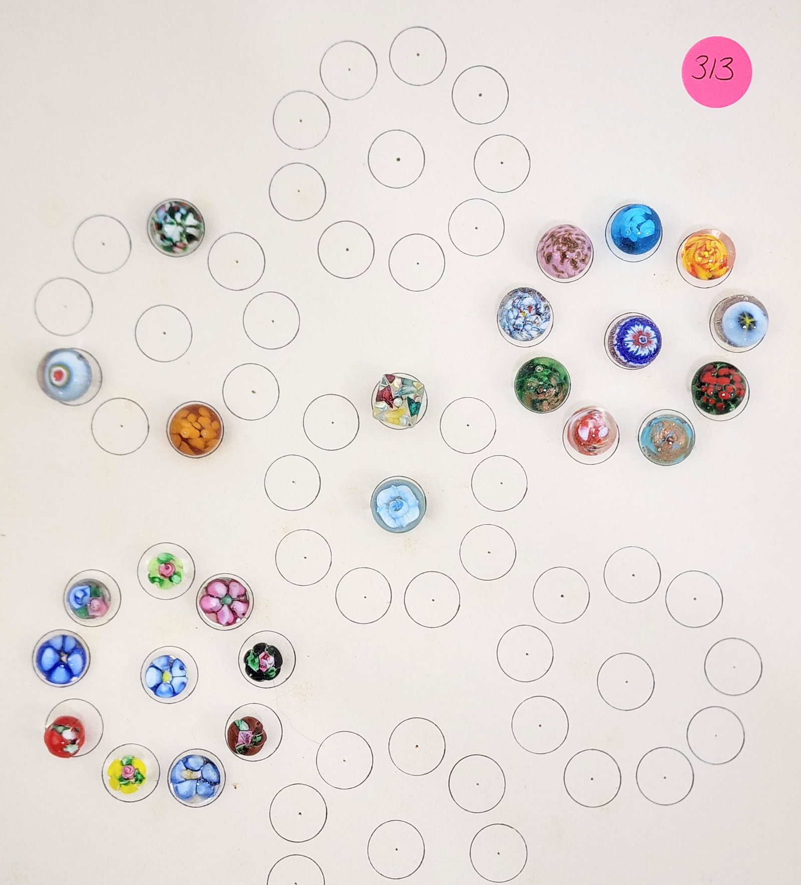 CARD OF PAPERWEIGHT BUTTONS: 20th century. Group of 25 glass paperweight buttons with flowers. .5"-.75” diameter