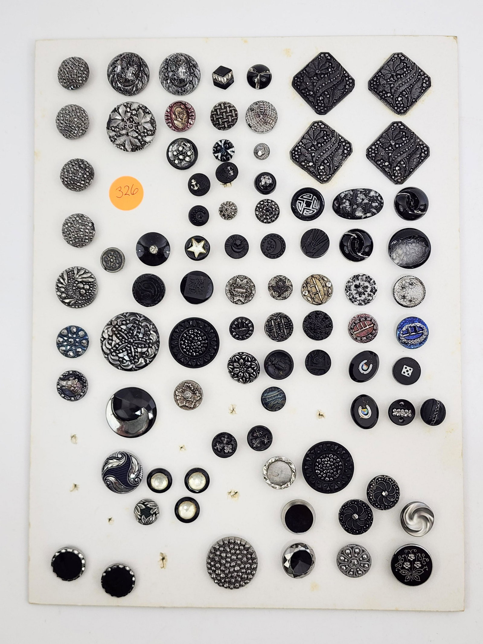 CARD OF VICTORIAN BUTTONS: 19th century. Jet, marcasite, inlaid and carved buttons. .25"-1.25" diameter