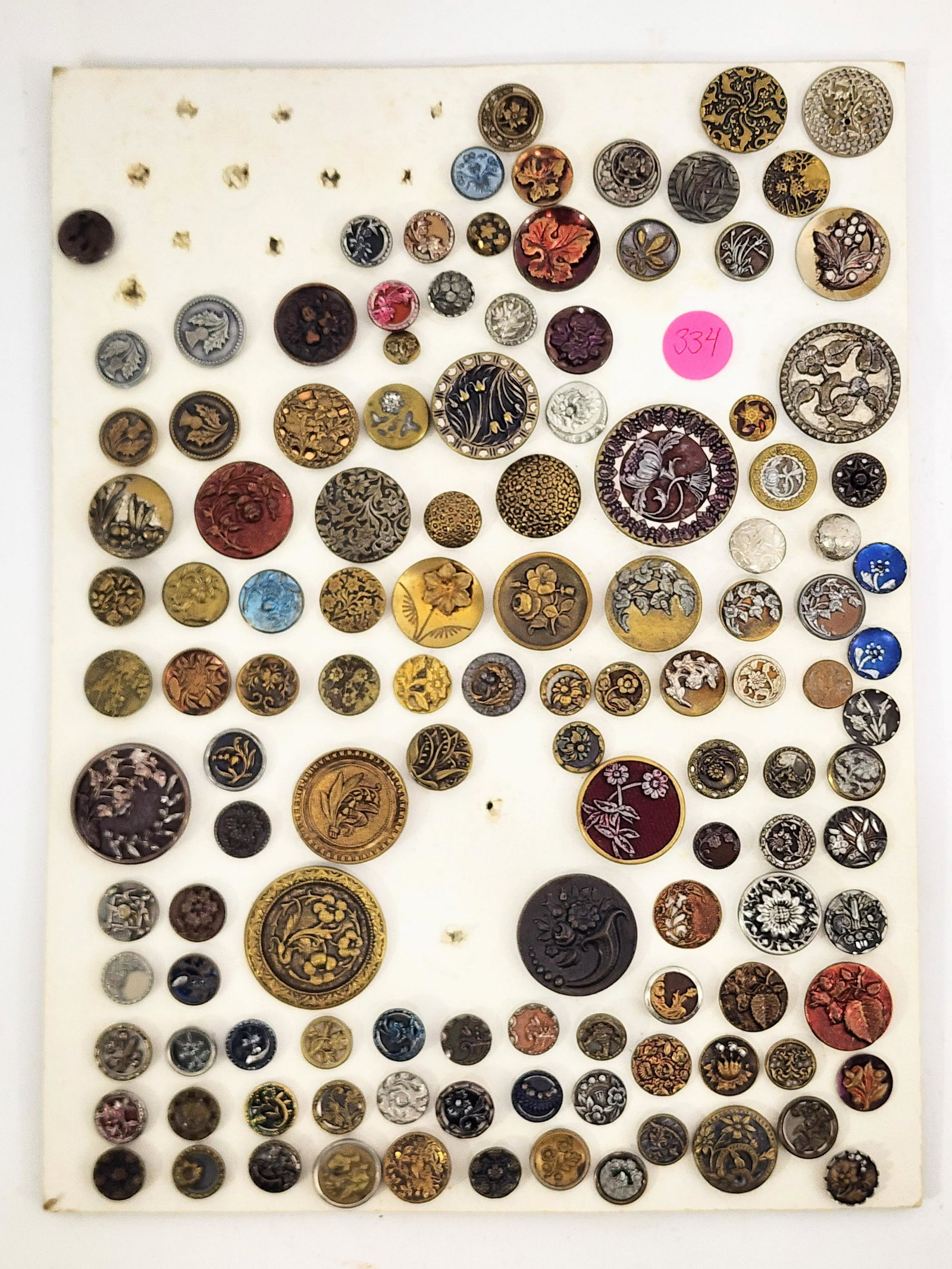 GROUP OF METAL BUTTONS: Late 19th-early 20th century. Large card of metal buttons including many steel cut. .5" - 1.5" diameter