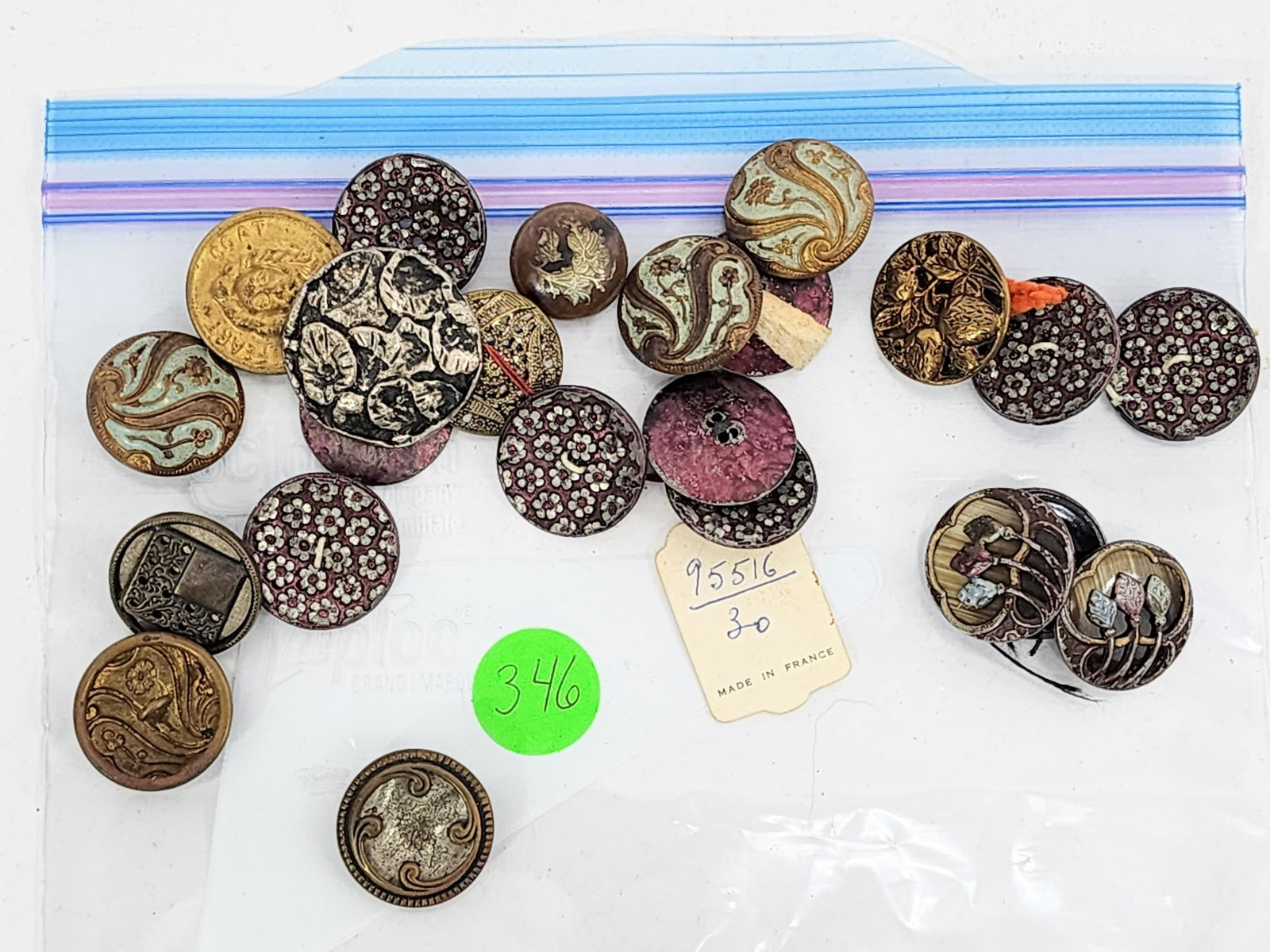 GROUP OF VICTORIAN BUTTONS: Late 19th-early 20th century. 23 larger buttons including enamel decorated, floral, French, inlaid and Peary Coat. .75" - 2" diameter