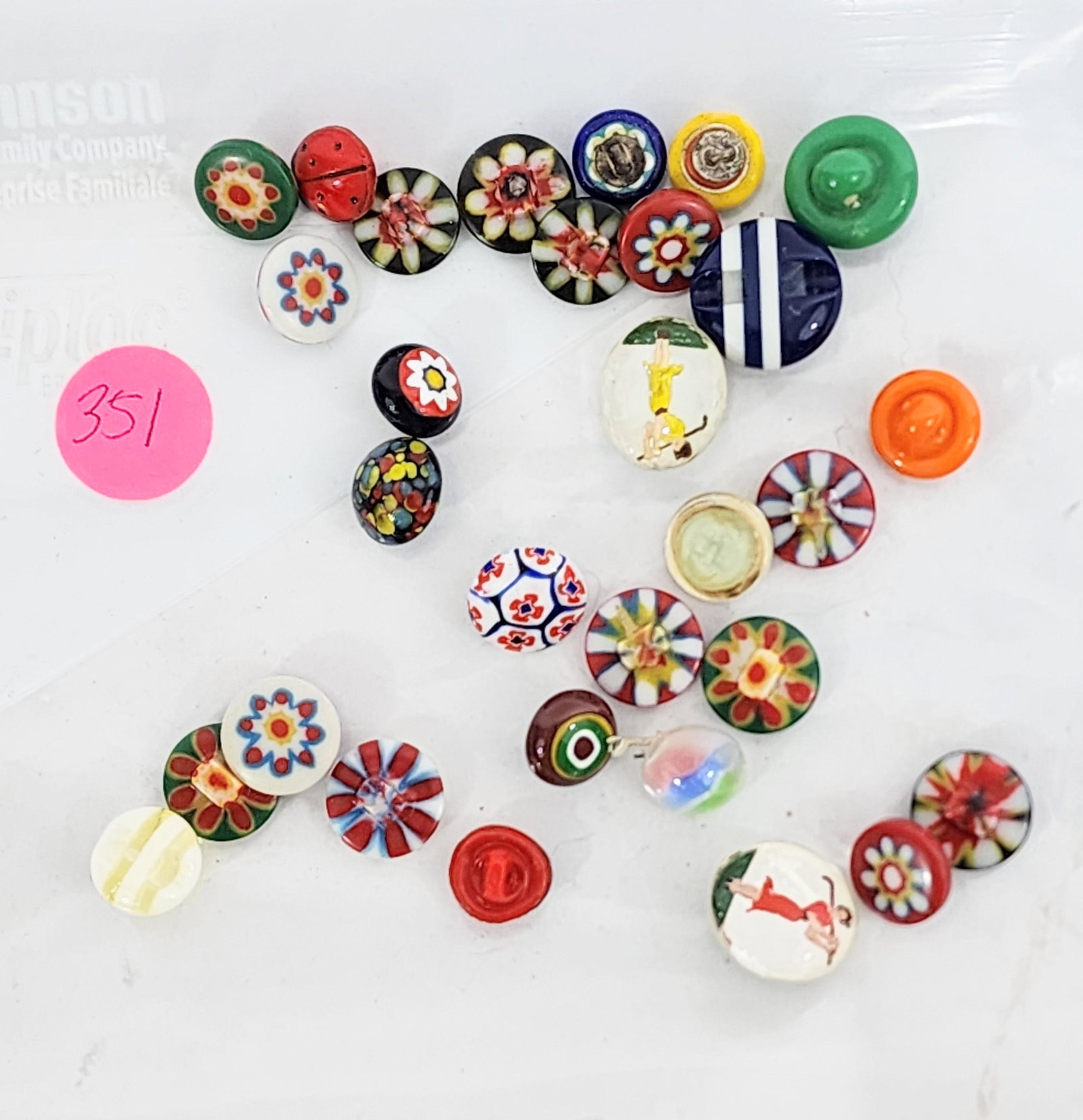 GROUP OF SMALL GLASS BUTTONS: 20th century. Group includes milifiori-style, two with female golfers, one with male golfer, etc. .25"-.75"diameter