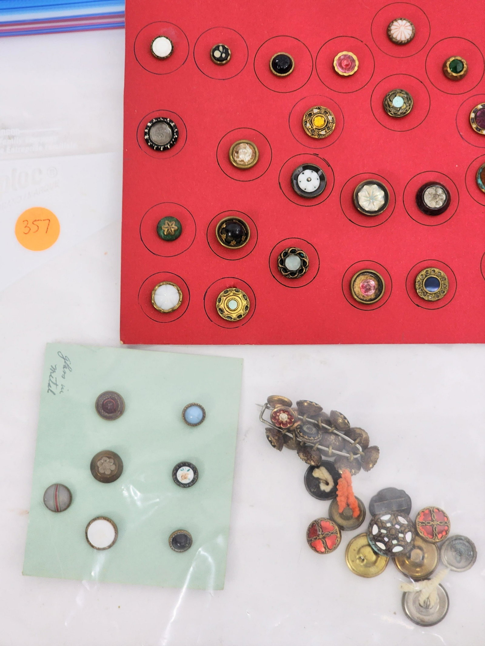 GROUP OF VICTORIAN BUTTONS: 19th century. Group includes glass in metal and metal collared buttons. Some mounted on cards. .375" - .5" diameter