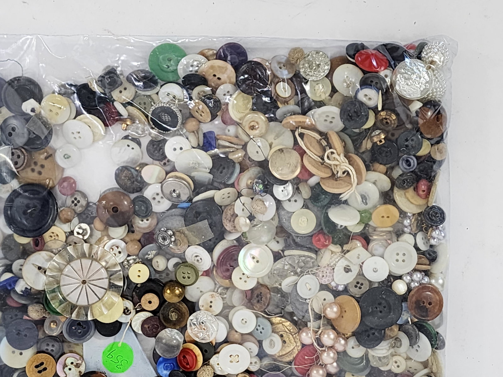 LARGE GROUP OF BUTTONS: 20th century. Buttons include plastic and wood, various styles, colors and some with rhinestones. .375" - 1" diameter
