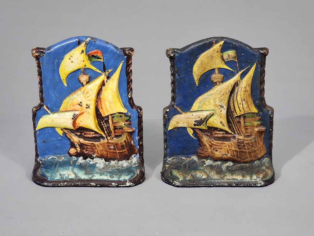 PAIR OF SHIP BOOKENDS: Eastern Specialty Co., early 20th century, cast iron. Retain their original paint. 6.5" high. SIQ