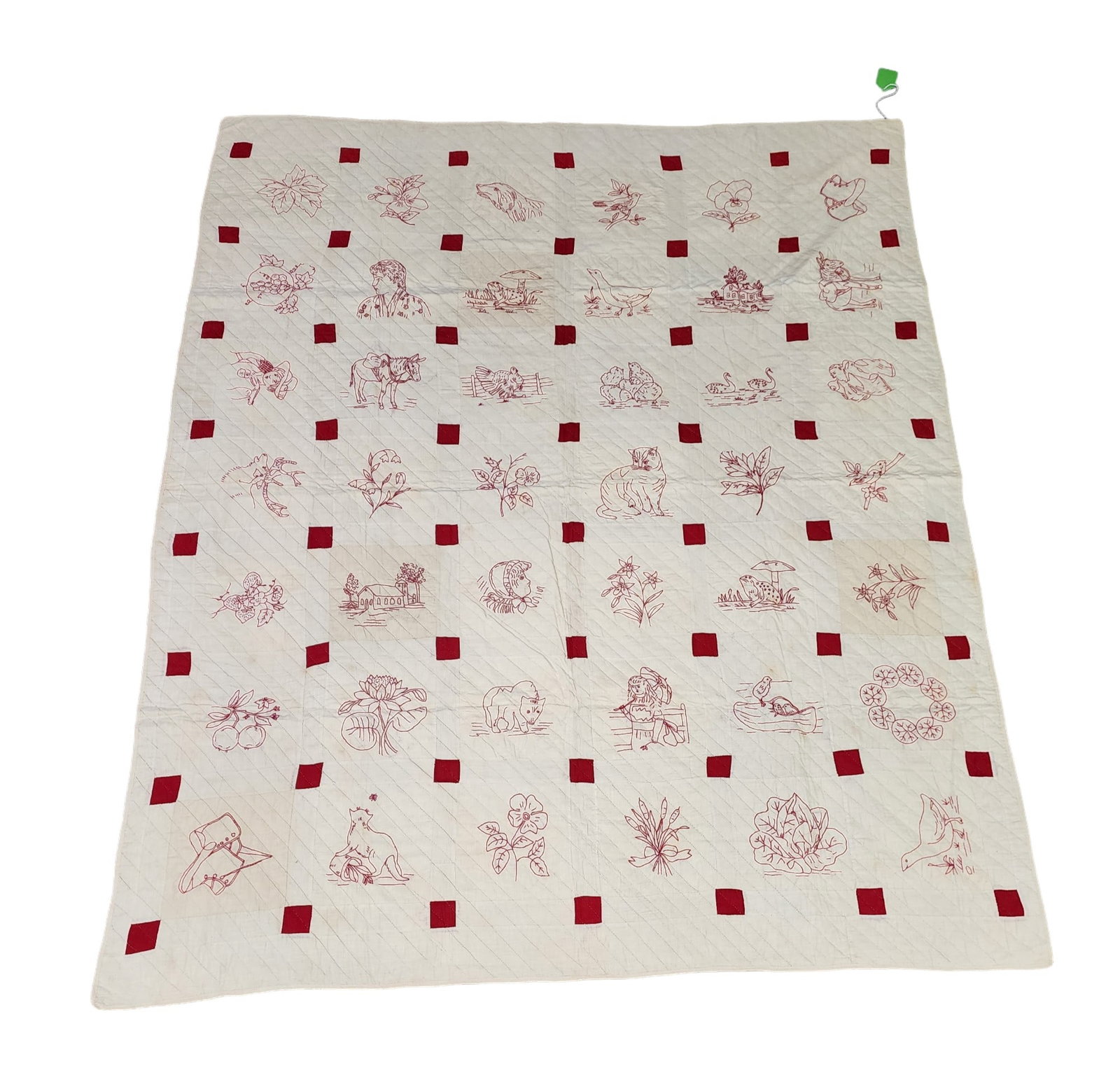 OHIO CHILD'S QUILT: Madison County, 1900-1910. Red and white, with embroidered designs. 73" by 59".