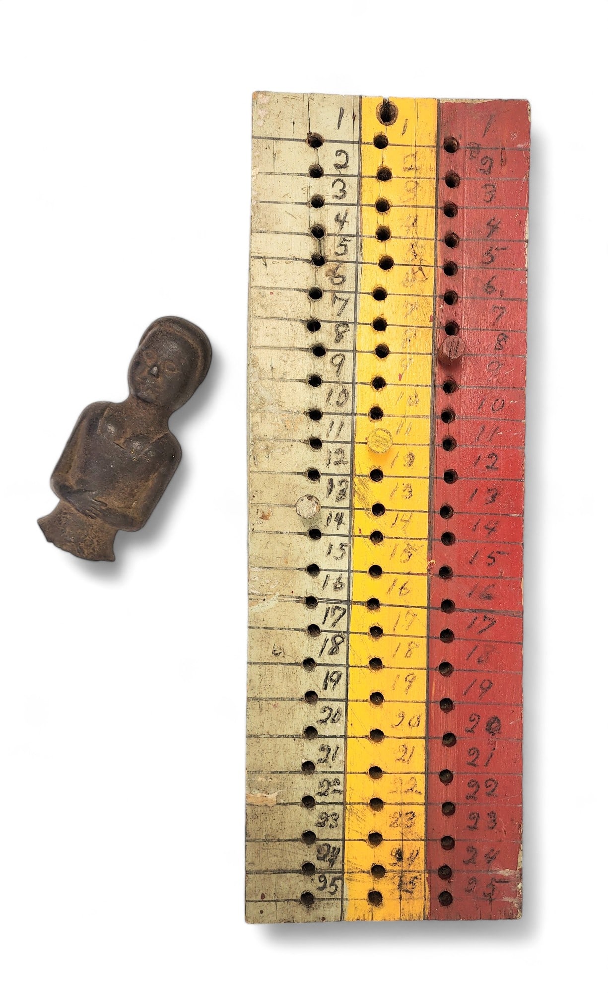 CRIBBAGE BOARD AND CAST-IRON FIGURE (1 of 4)