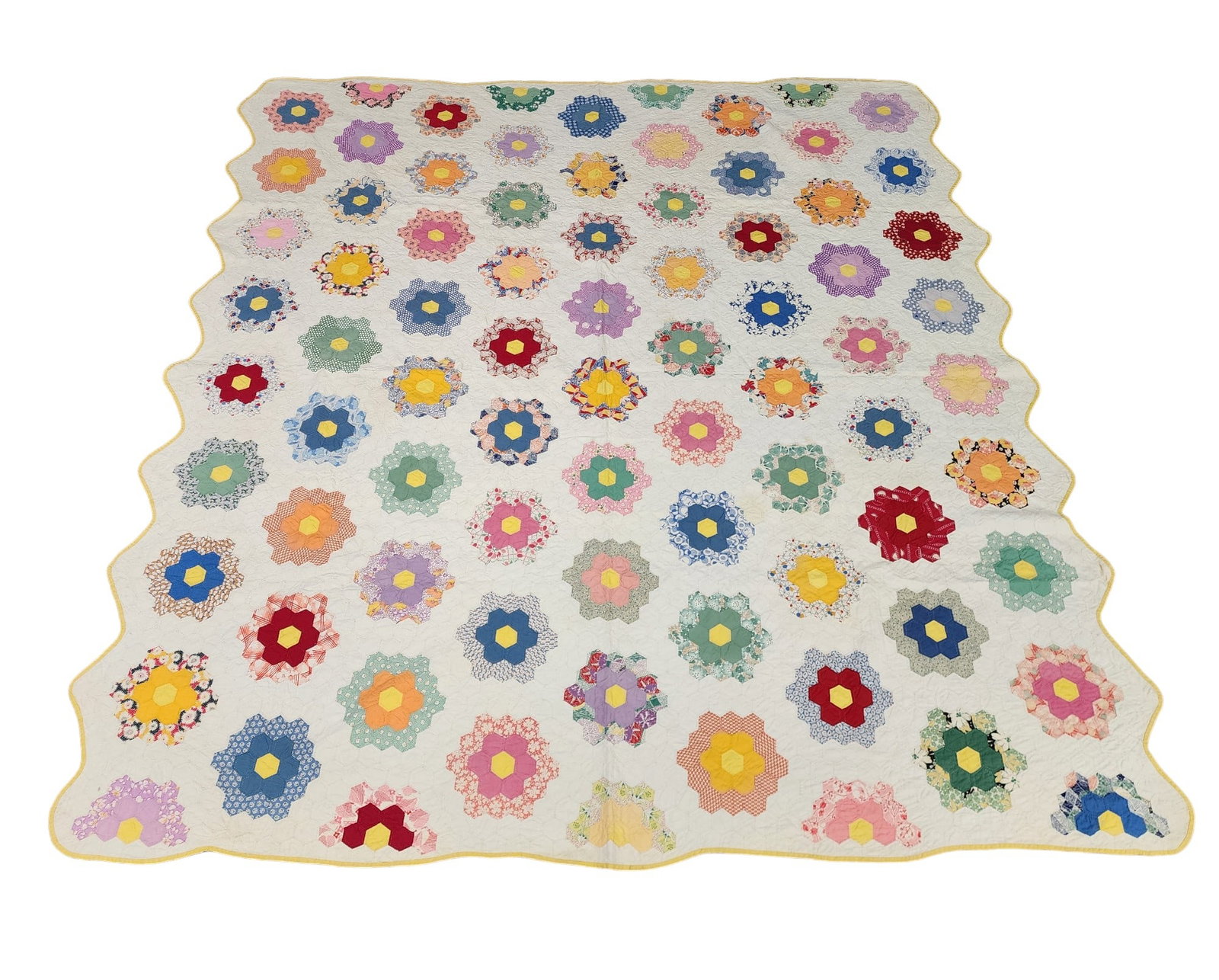 FLOWER GARDEN PIECED QUILT: American, c. 1940, cotton. Summer weight, scalloped edges, in pastel colors. 87" square.