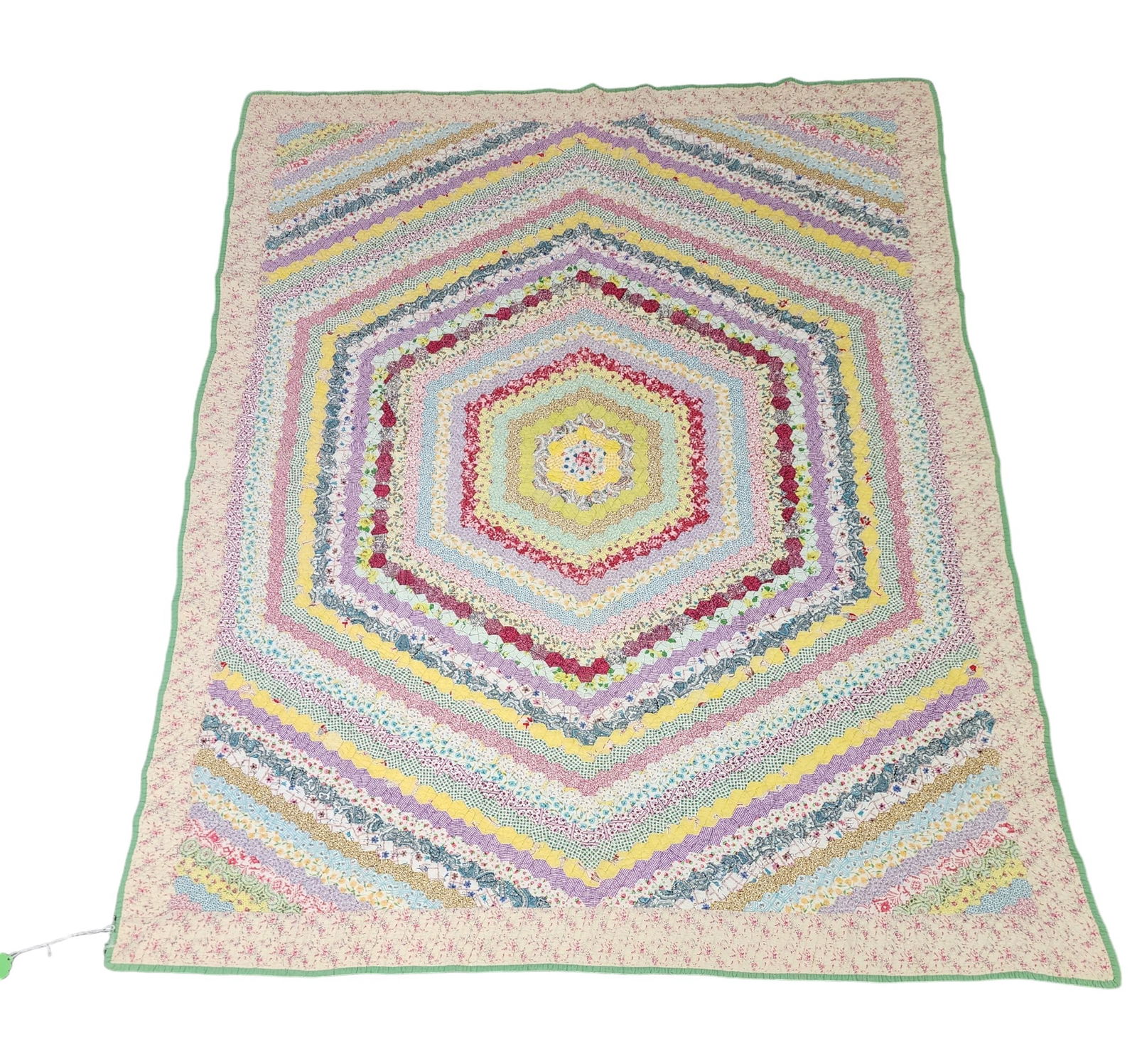 HEXAGON MOSAIC PIECED QUILT: American, mid-20th century, cotton. Vibrantly made in pastel colors. 80" by 62".