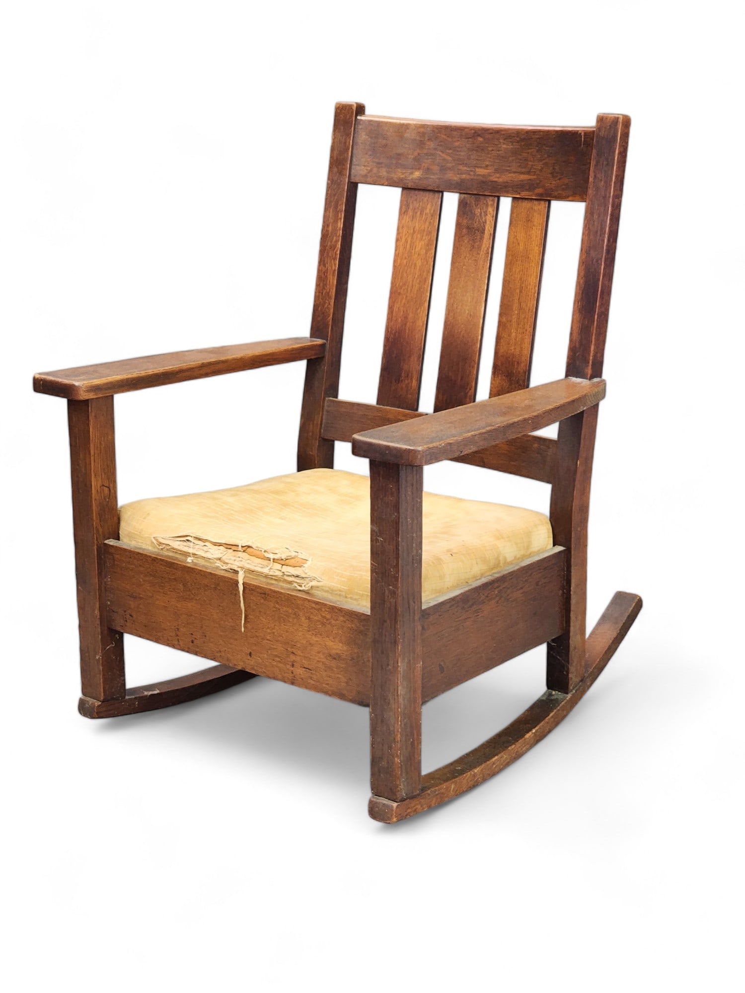 STICKLEY ARTS AND CRAFTS ROCKING CHAIR: Quaint, Grand Rapids, Michigan, early 20th century, oak. With vertical slats. 36.5" high.