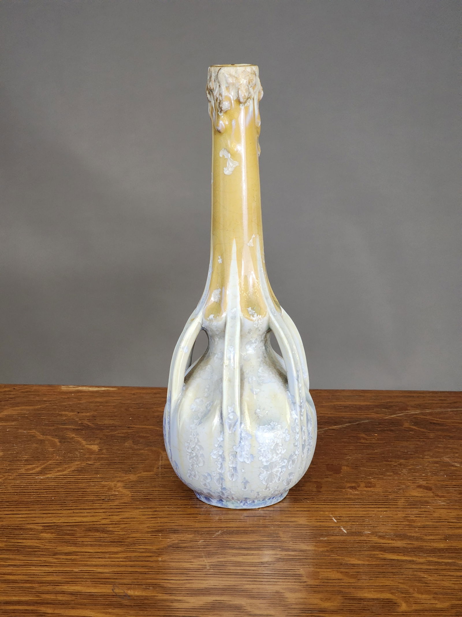 FRENCH ARTS AND CRAFTS VASE: Girault, Demay et Vignolet Porzellanmanufaktur (G.D.V.), Brure, France, c. 1900. Narrow neck, multiple handles, and blue crystalline glaze. 8.5" high.