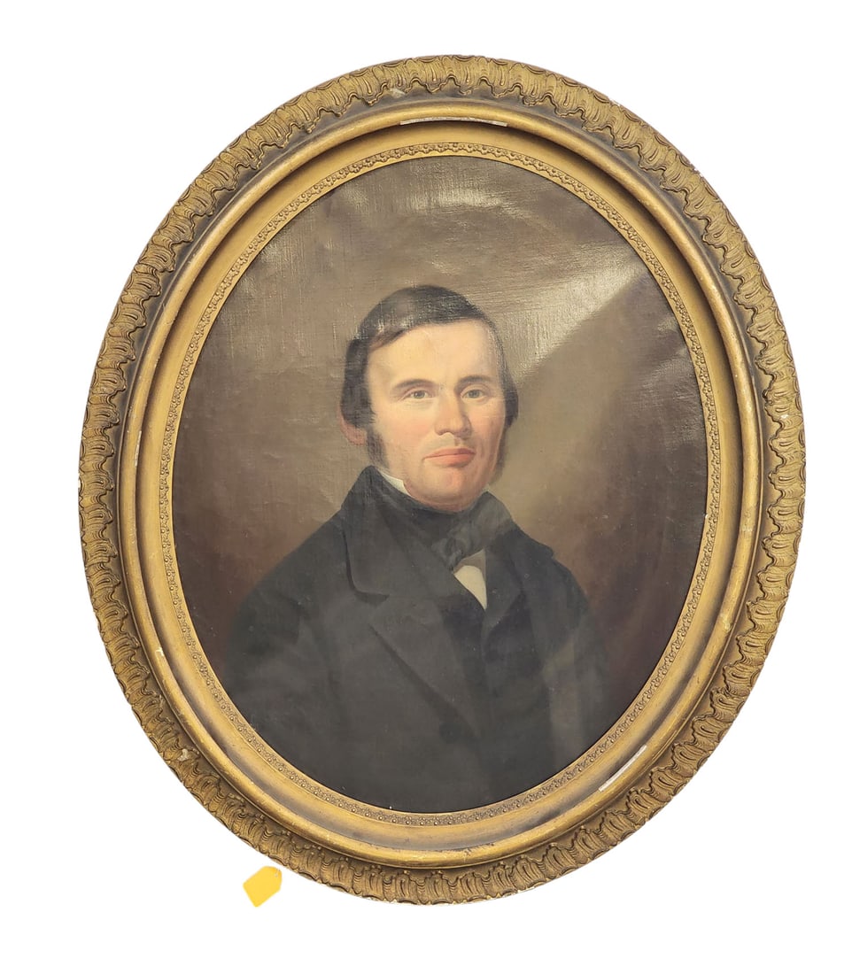 PORTRAIT OF A CINCINNATI, OHIO GENTLEMAN: c. 1860, oil on canvas, unsigned. Bust-length portrait of a 40-something man in black suit. Oval format in its original frame that retains an art supply label for A.P.C. Bonte, Cincinnati, Ohio. 26" h