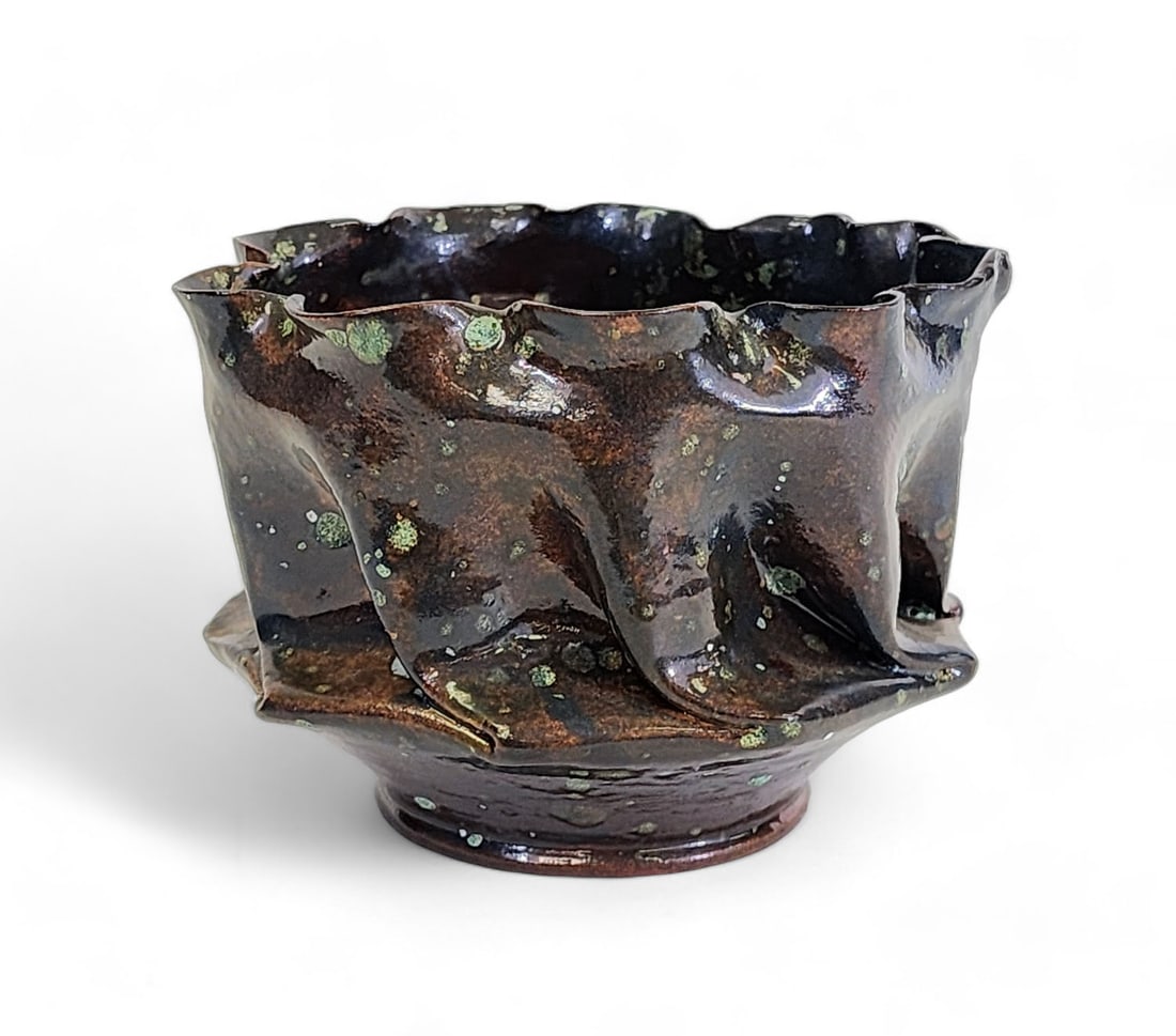 CRUMPLED VASE BY GEORGE OHR (MISSISSIPPI, 1857-1918): Incised "GE Ohr" on the underside. With regularly pinched and crumpled body and rim, and with a later glaze. 3.25" high.