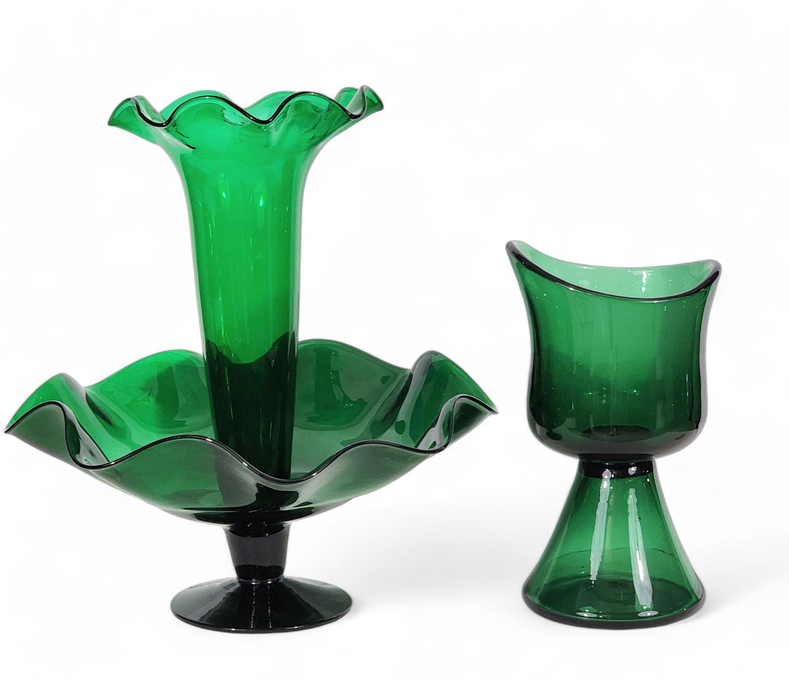 TWO PIECES OF DARK GREEN MID-CENTURY GLASS: Includes a possibly Empoli goblet or footed vase, 10.75" high; together with a Blenko 953 epergne with ruffled rims, 15" high.