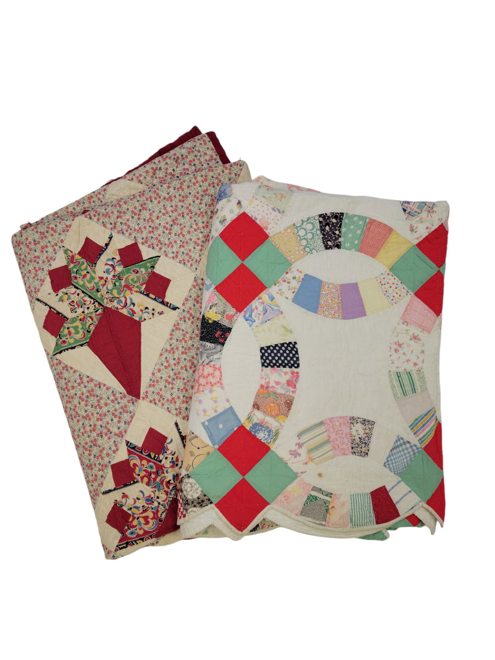 TWO PIECED QUILTS: American, early 20th century. Bouquet, 82" by 66"; and wedding ring, 87" by 87".