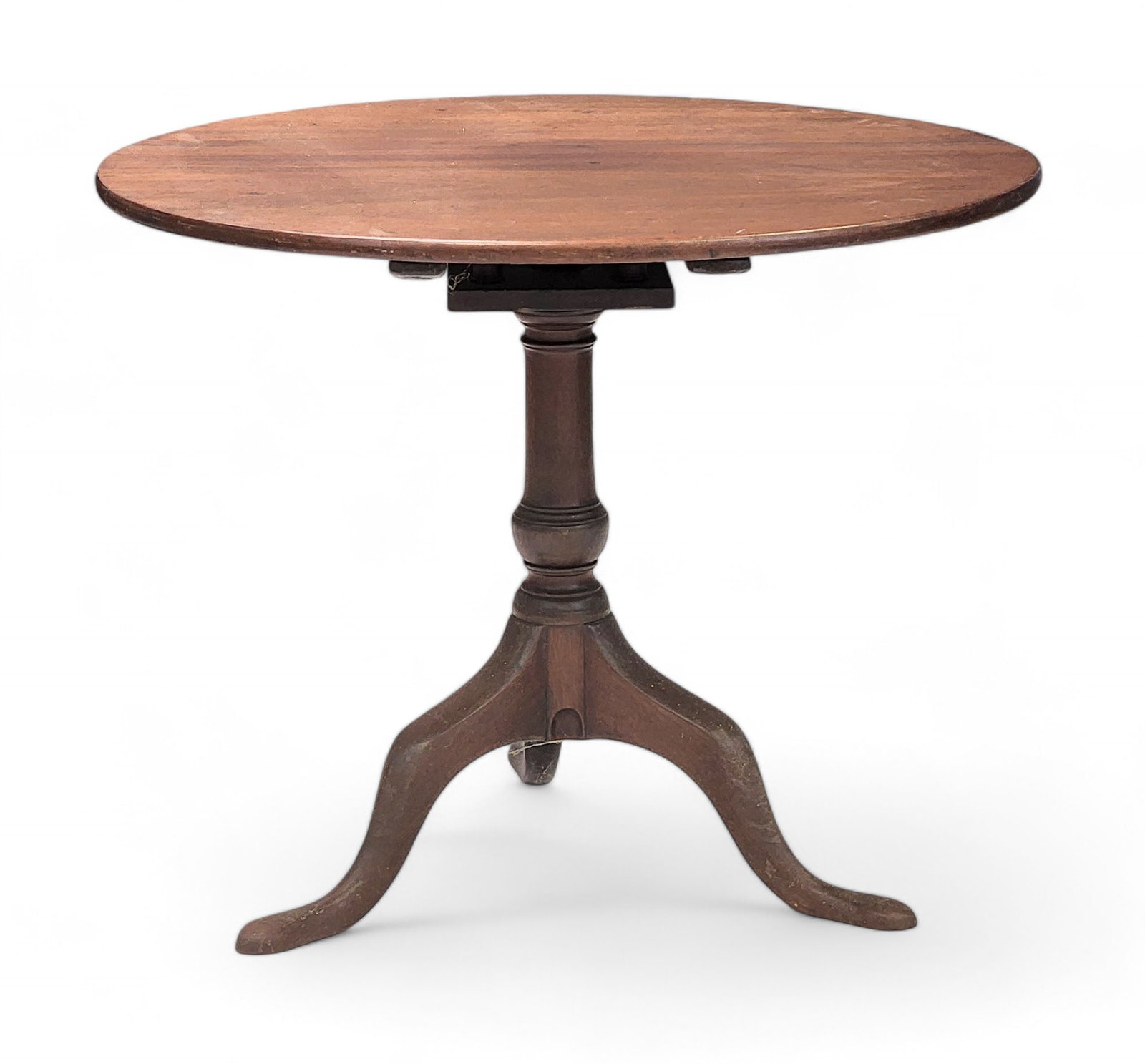 CHIPPENDALE TILT-TOP TEA TABLE: Pennsylvania, late 18th century, walnut. Two-board top, birdcage tilter, and cabriole legs ending in pad feet. 28" high, 32" diameter.