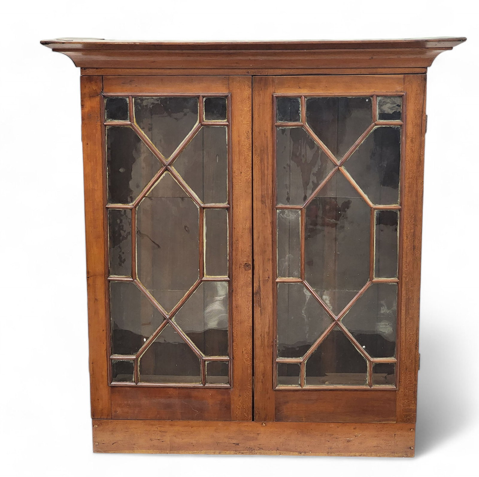 BOOKCASE TOP: American, early 19th century, cherry and poplar. With geometric panes. 45" high, 42.5" wide, 14.5" wide.