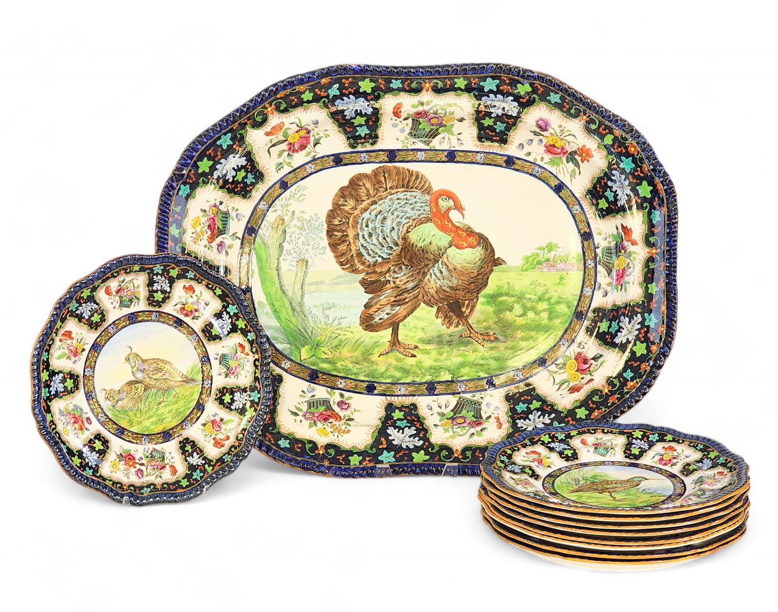 COPELAND SPODE TURKEY PLATTER AND PLATES: English, late 19th century. Transfer-print with overglaze enamel decoration. A highly colorful set, including a 18" by 23" turkey platter and nine 10.5" dinner plates featuring various game birds, inc