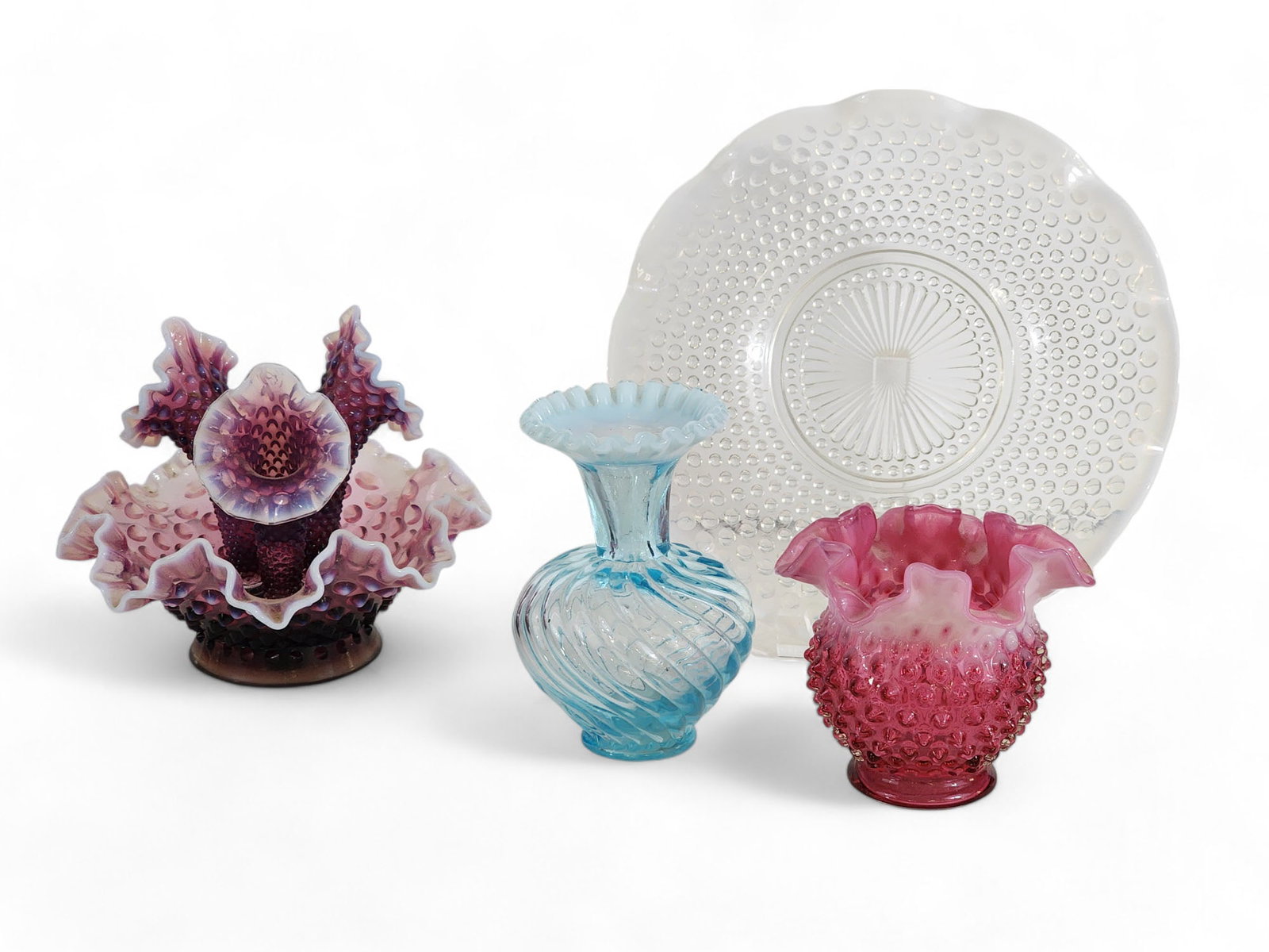 FOUR PIECES OF OPALESCENT HOBNAIL GLASS, INCLUDING FENTON: 19th-20th century. Includes an amythest epergne, two vases, and a white tray. Tray is 10.75" diameter.