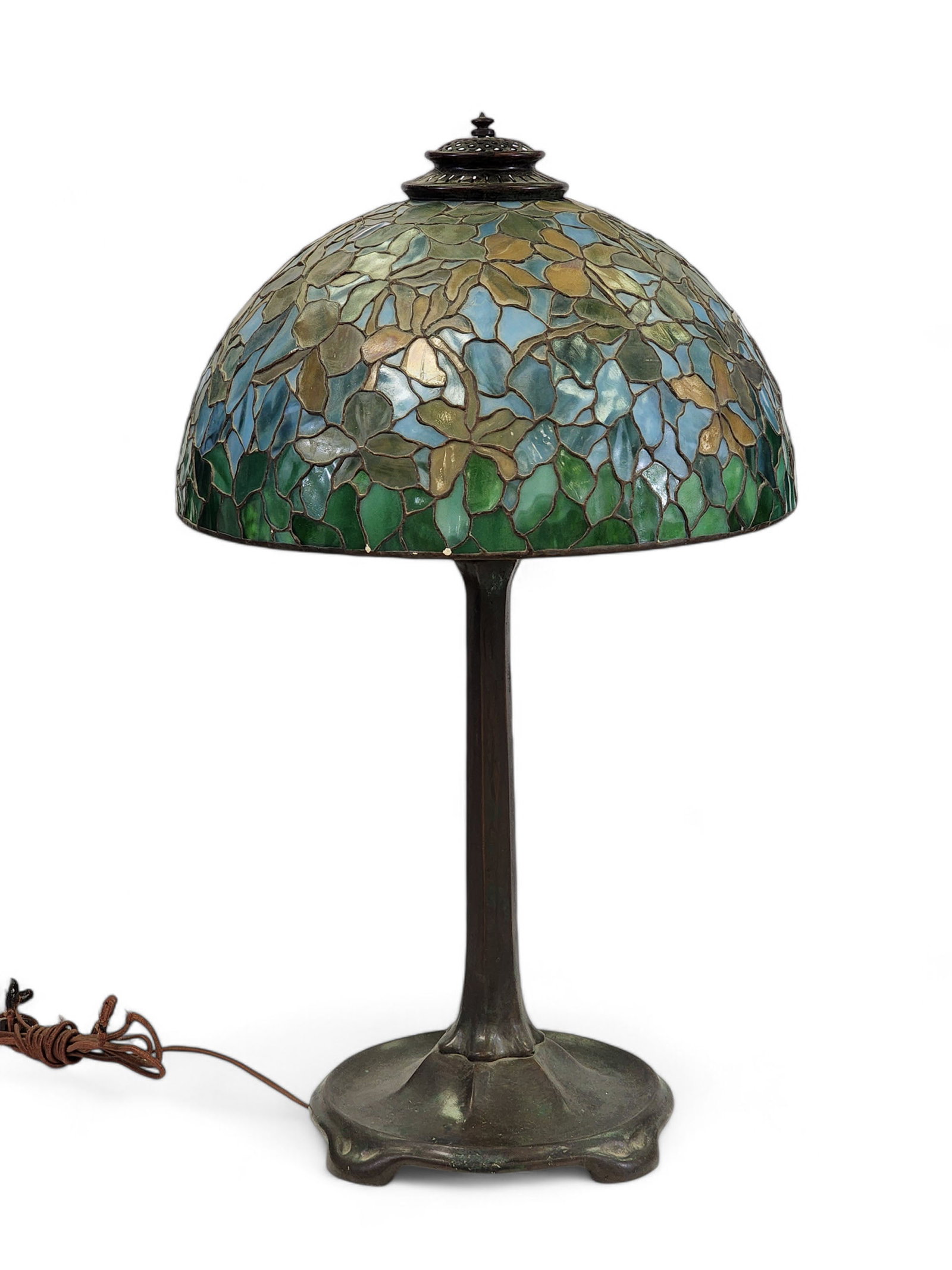 TIFFANY STUDIOS 531 LAMP BASE: New York, early 20th century, bronze. Marked "TIFFANY STUDIOS NEW YORK 531." 25" high (to the support ring, excluding the bolt). Together with an associated stained glass shade in the Tiffany style.