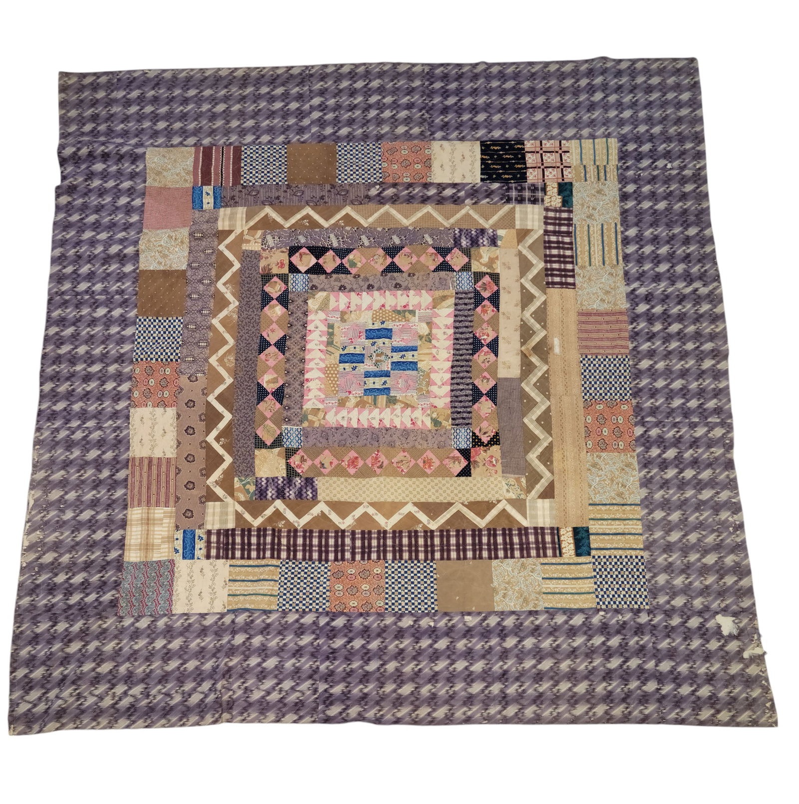 PIECED QUILT: Miss A. Watson, dated 1850, cotton. Somewhat abstract design of a wide variety of printed cottons, with a vibrant printed purple border. Stamped on the back "Miss A. Watson 1850." 84" by 82".