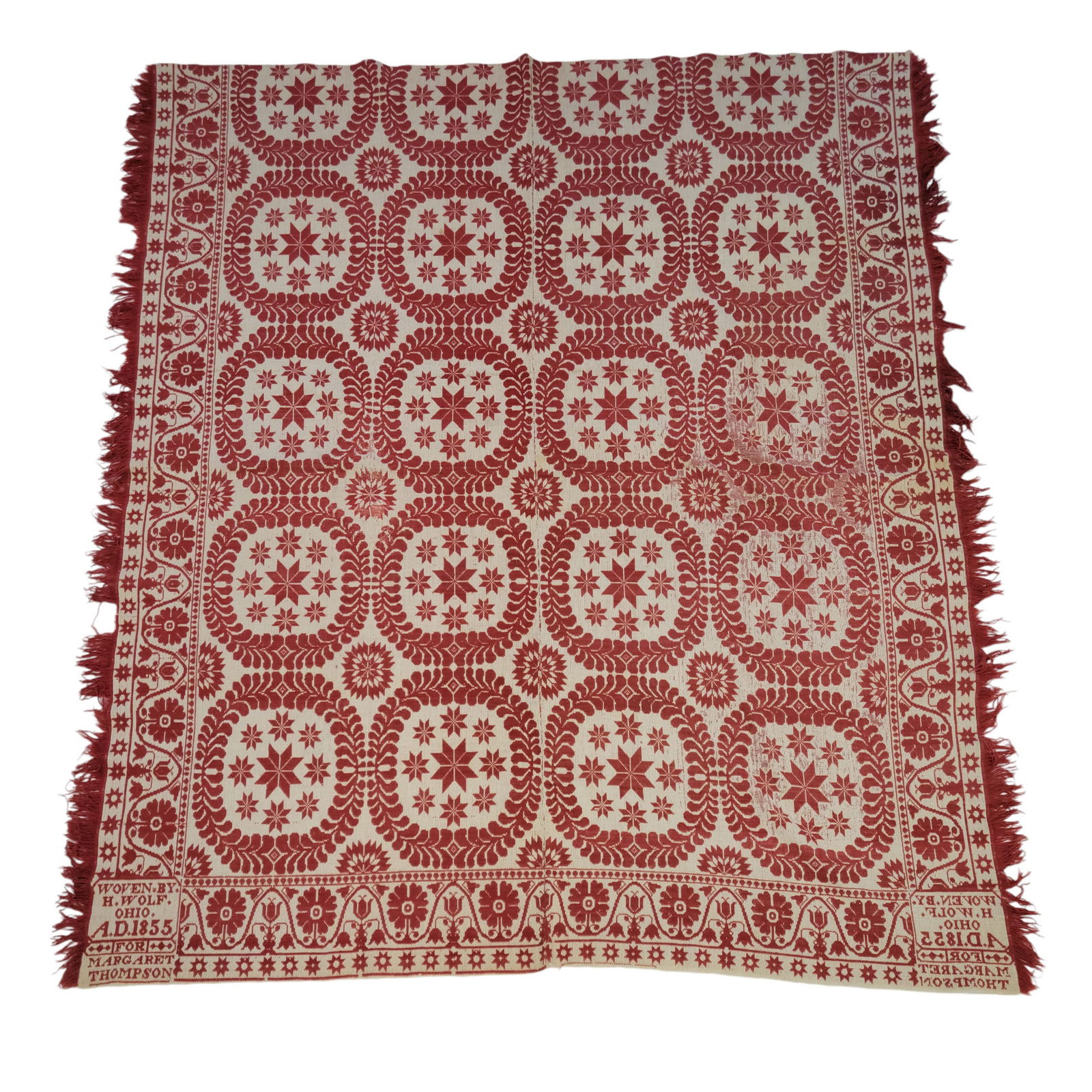 RICHLAND COUNTY, OHIO COVERLET: Henry Wolf for Margaret Thompson, 1855. Red and white with wreaths and stars, with a flower and star border. 88" by 76".